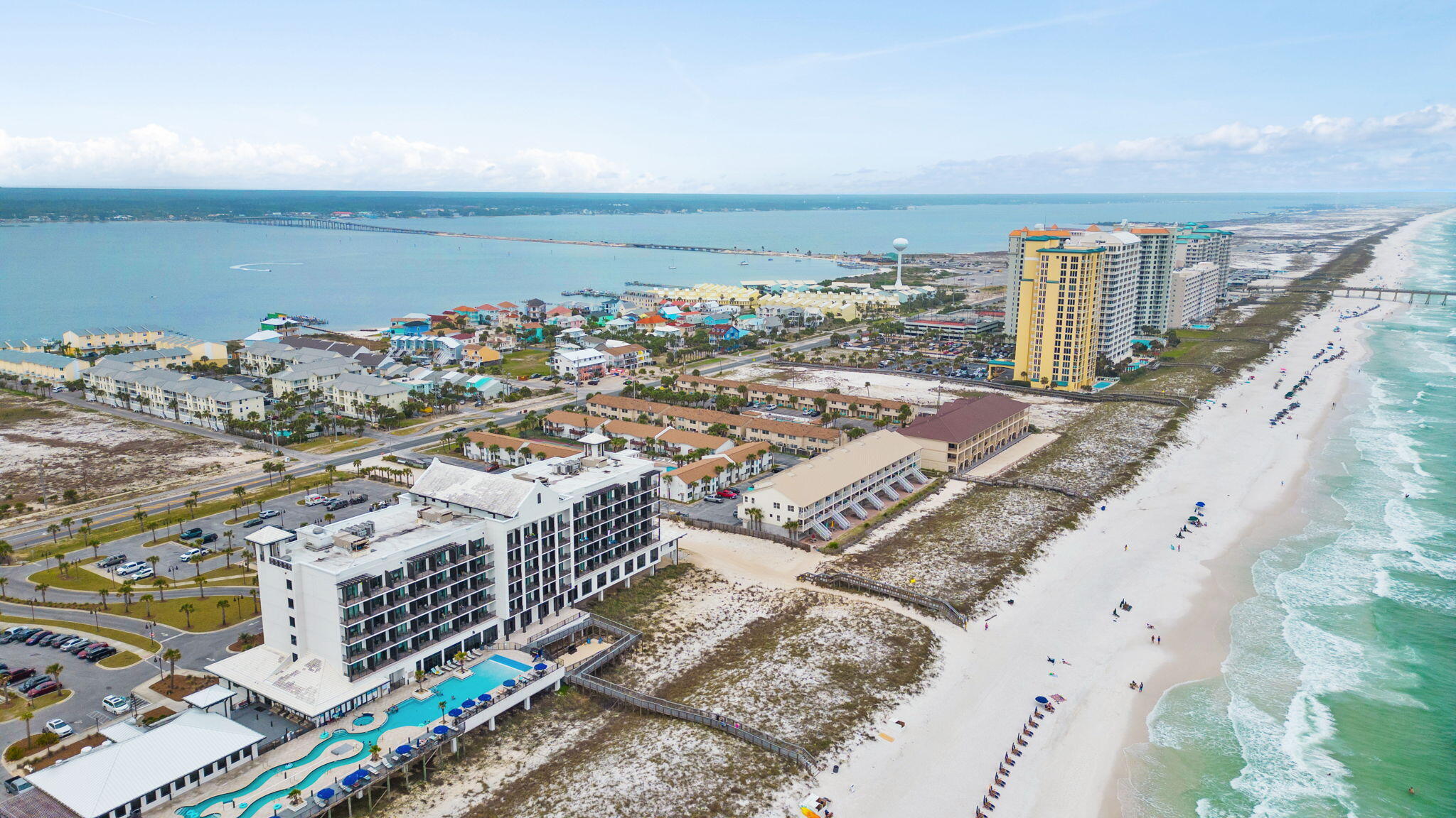Welcome to a rare opportunity to own a vacation home that is steps away from the Gulf side white sandy beaches and turquoise waters. Brand new roof, new HVAC unit, and new water heater! Currently occupied, but these units can be short term rentals like majority of them. They make an incredible ROI for sure. If you have been searching for a money maker on the GULF SIDE with a pool, than this is it! This remarkable town home is a two story that features 2 large bedrooms and three bathrooms total. The home also has a laundry room with brand new washer /dryer that has an app on your phone to control settings so you don't have to travel for miles to find a laundry-mat or even share one. The privacy is incredible because you also get a private back yard. The shed will convey as well.