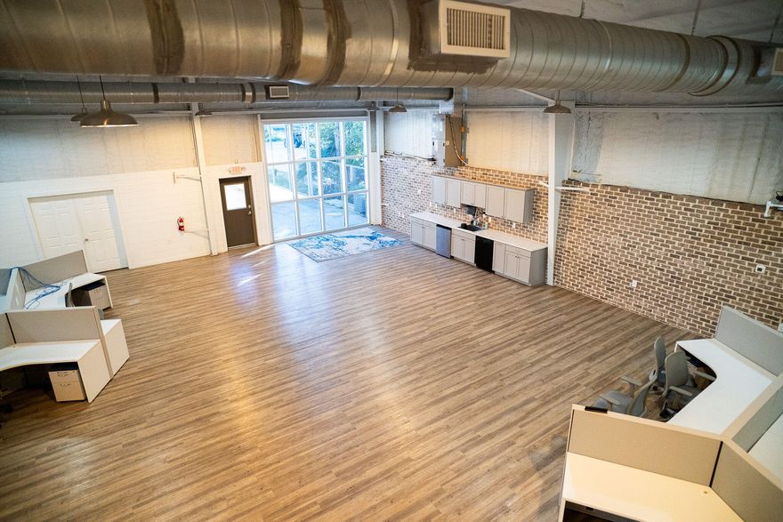 The approximate .84-acre site has exceptional ingress and egress, with 120' fronting Airport Road, as well as 120' to the rear on Industrial Park Road, featuring a loading dock. The site is zoned Industrial. The modernized interior and its layout consists of a main floor and mezzanine level.The main floor is comprised of a spacious lobby with two bathrooms, six offices (the largest executive office features an lavish full bath), two conference rooms, a break room, IT room, an expansive bullpen serviced by a beautiful kitchen and work island. The mezzanine level can accommodate expanded workspace, seminar etc