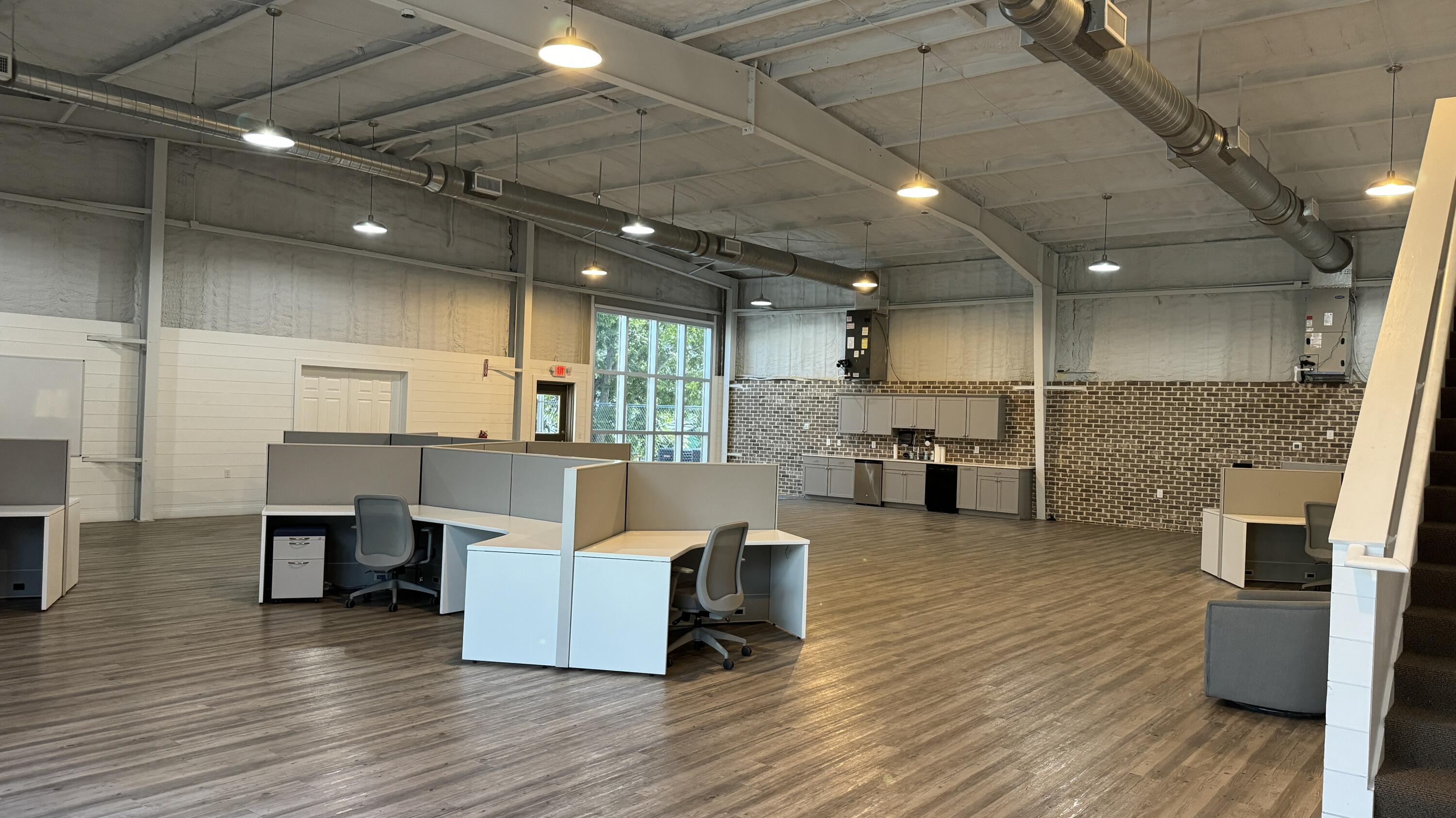 The approximate .84-acre site has exceptional ingress and egress, with 120' fronting Airport Road, as well as 120' to the rear on Industrial Park Road, featuring a loading dock. The site is zoned Industrial. The modernized interior and its layout consists of a main floor and mezzanine level.The main floor is comprised of a spacious lobby with two bathrooms, six offices (the largest executive office features an lavish full bath), two conference rooms, a break room, IT room, an expansive bullpen serviced by a beautiful kitchen and work island. The mezzanine level can accommodate expanded workspace, seminar etc