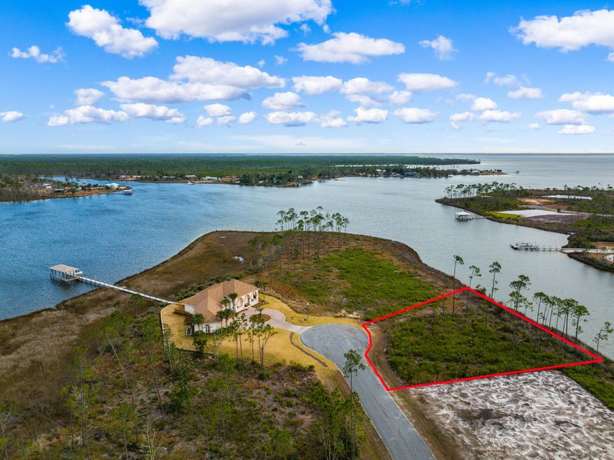 Gorgeous 1/2 acre waterfront lot with access to the intercoastal waterway and located in an exclusive gated community. This lot has 180 feet of waterfront, directly on the water. Other similar lots are on a marshy area and not directly on the water, making this one easy to build a home and have the dock built to extend all the way to the home. This is a unique lot at the end of a private culdesac and at the mouth of the bayou leading to deep water. Laird Bayou is a gated community with low HOA fees, community pool, boat launch and boat storage. This lot is rare and will not last long!