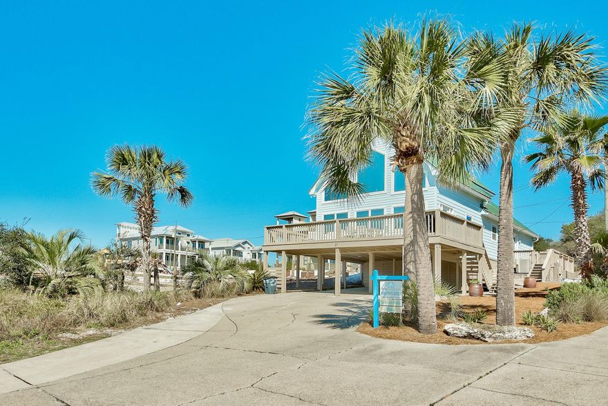 The perfect beach cottage with forever gulf views in sleepy , quiet Inlet Beach. Close enough to the amenities and charm that 30A has to offer but set on top of a bluff where you can enjoy both sunrise and sunsets. As you enter the front door, you arrive in such a bright and airy living area that attracts your focus on the sea and bright sunshine. The unusually high ceiling adds to the vast amount of sunlight, setting your beach mood instantly. Built-in cabinets holding your favorite beach reads are set on the south side of the space which coincides with the very expansive, open kitchen/dining area which creates an abundance of space for those family beach get togethers. On the front of the house is an expansive wrap around deck, perfect for enjoying an outside breakfast, lunch or dinner.