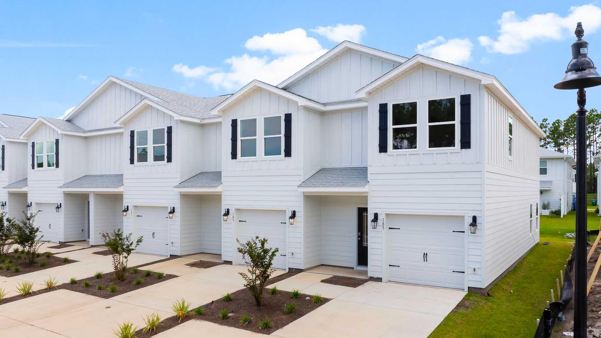 Welcome to 32 Rudder Lane at Genoa Landing Townhomes in Freeport Florida. This is an exterior unit that is located in a four unit building that is under construction. As you enter this townhome you will find a hall with EVP flooring that leads to an open-concept kitchen, living, and dining area, designed for entertaining and everyday living. The dining area is surrounded by windows that allow for natural light. The kitchen serves as the culinary center with its spacious center island and cabinetry for storage as well as a pantry. The kitchen has been appointed with stainless appliances including a stove, microwave and dishwasher and granite countertops