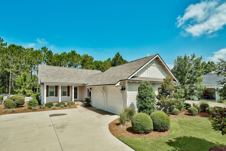 THE EASY LIFE YOU ARE DREAMING OF! Welcome home to this stunning, one-level living 4 BD/4BA Watersound Origins ranch that backs up to the LARGEST GREEN SPACE in the neighborhood! Inviting rocking chair front porch invites you in to a wonderful open floor plan, light and bright with gorgeous hardwood floors and tile throughout with plantation shutters, recessed lighting and modern, sophisticated features and finishes at every turn. Spacious kitchen with stone counters, breakfast bar, stainless steel appliances, and built in desk nook. Serene owners suite with spa bath and nicely appointed secondary bedrooms and baths. Imagine enjoying the panoramic landscape of unspoiled nature from your screened back porch plus a large stone paver patio great for grilling and entertaining.Stroll through