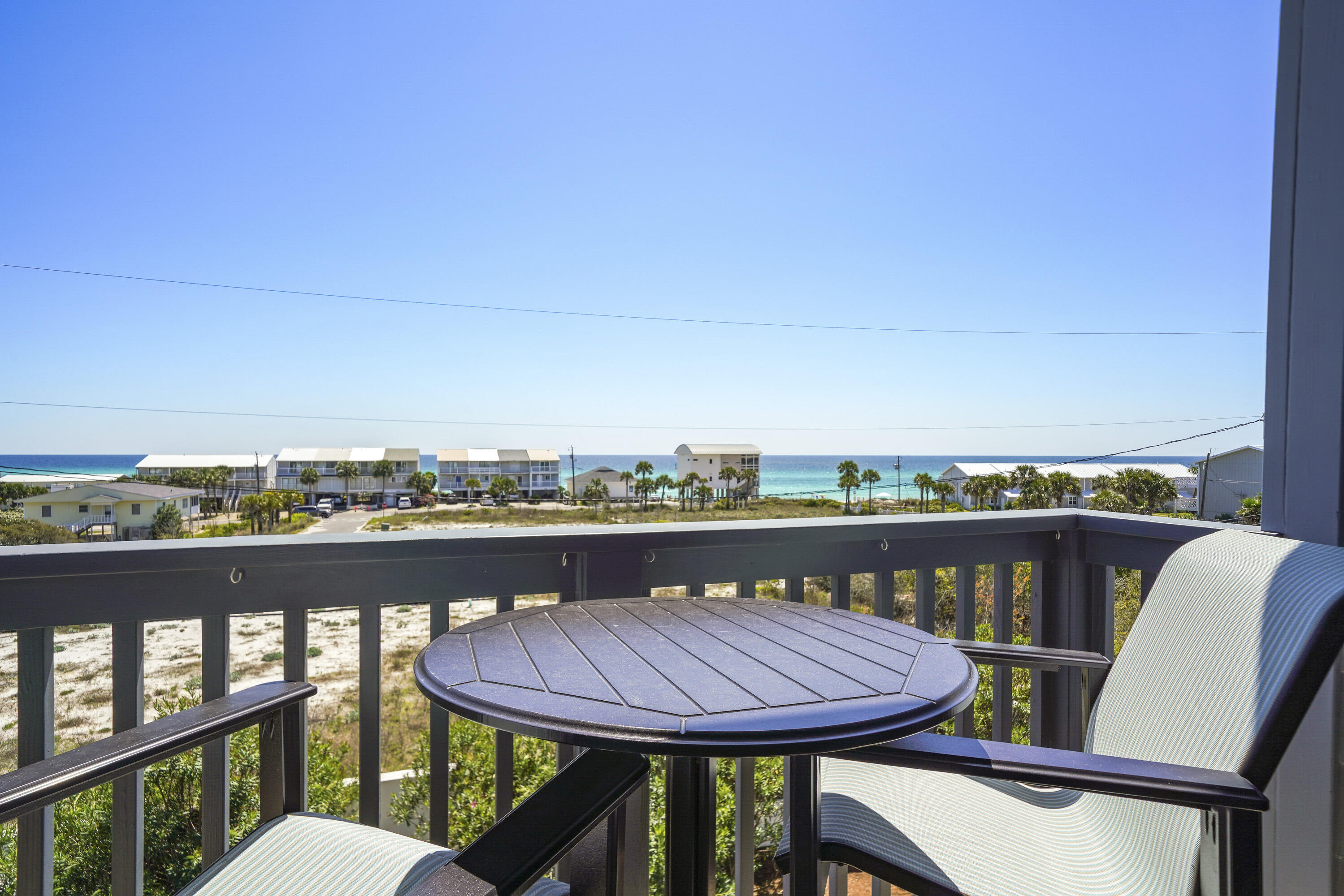 One block from the beach with amazing gulf views! This home features an elevator to all floors, private 1st floor fully-equipped apartment, private heated pool, heated/cooled 1.5 car garage, balconies on all levels, 2 kitchens, 4th floor tower, and hardwood flooring throughout. The 1st level apartment has a kitchen with everything you need including an ice machine, a full bath, french doors leading out to the pool area with built-in gas grill, and ample space to turn this into a game room or multi-bed bunk room. The 2nd floor is home to 2 Master Bedrooms, both with en suite baths and private balconies, and a Bunk Room with its own full bath. A 3rd Master Suite with private balcony can be found on the 3rd level, along with the main living areas. The oversized kitchen is outfitted with high-