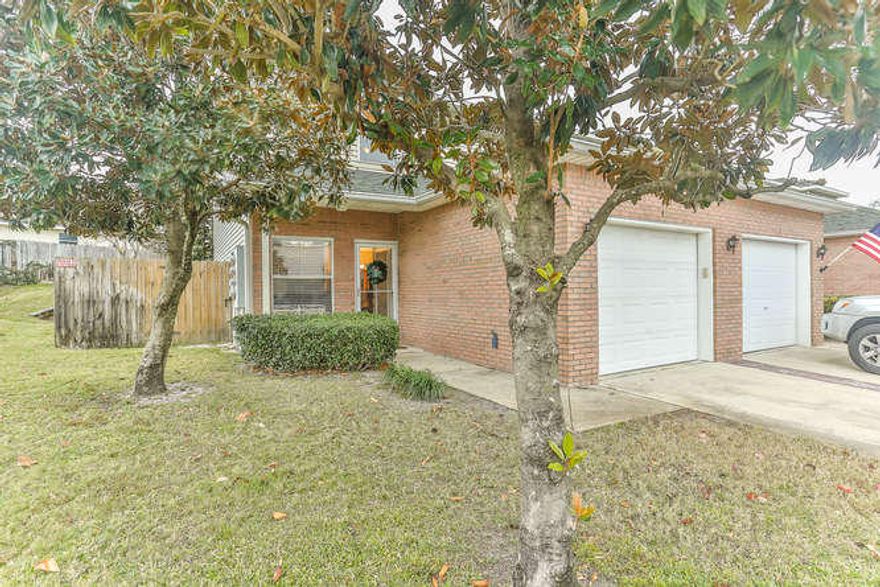 Beautiful, maintained corner unit next to the community pool. Covered porch and fenced yard perfect for outdoor entertaining. The kitchen boasts of newly installed subway tile, painted cabinets, large pantry and brick accent wall. All appliances were replaced 3 years ago. New AC unit installed January, 2017. Bedrooms have walk in closets. Laminate flooring & tile downstairs and real Heart Pine wood flooring upstairs (no carpet). Bedroom windows have been replaced. Sliding glass doors installed 3 years ago. One car garage has painted floor. Seller's insurance is only $1200/year. Magnolia Park is centrally located in Destin. All appliances convey. Being sold unfurnished.