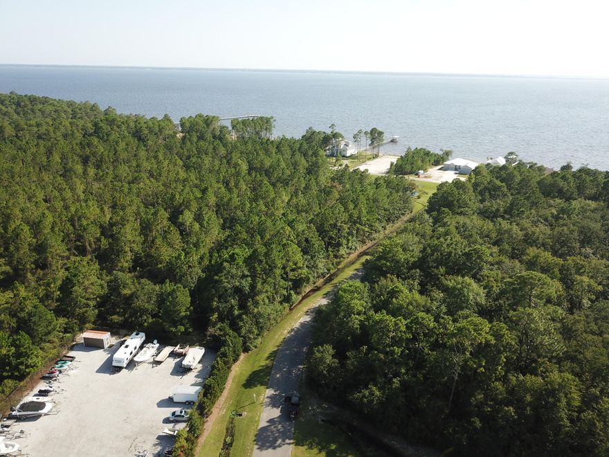 Large oversized lot to build your bayside dream home! Quite private neighborhood with many stunning custom homes currently being built. Bay Harbour features community dock, tennis court, boat Storage, and acres Of preserved areas To enjoy the outdoors.