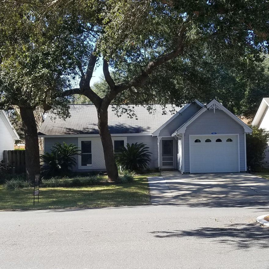 THIS LOVELY 3 BEDROOM/2 BATH HOME IS NESTLED ON A AWESOME LOT IN QUAINT BLUE PINE VILLAGE. IT IS A PERFECT STARTER HOME, RETIREMENT HOME OR RENTAL PROPERTY. WITH NATURAL LANDSCAPE, BIG, BEAUTIFUL TREES, FENCED IN BACK YARD IT OFFERS AN EXTERIOR TO BE ENJOYED. THE OPEN FLOOR PLAN BOASTS BEAUTIFUL FLOORS AND A NICE AIRY FEEL. THE KITCHEN HAS A GARDEN WINDOW THAT CONTINUES TO BRING IN NATURAL LIGHTING ALONG WITH STAINLESS APPLIANCES AND GRANITE COUNTER TOPS. MASTER BEDROOM HAS WALK IN CLOSET AND NEW CARPET. ADDITIONAL BEDROOMS HAVE NEW CARPETING AS WELL. THE ADORABLE BACK YARD IS FENCED IN AND PERFECT FOR ENTERTAINING SMALL GROUPS OR ENJOYING BY YOURSELF. BACK DOOR HAS SMALL DOGGY DOOR FOR YOU FURRY FRIENDS. ADDITIONAL FEATURES: MOTION LIGHTING/HURRICANE SHUTTERS/KEYLESS ENTRY