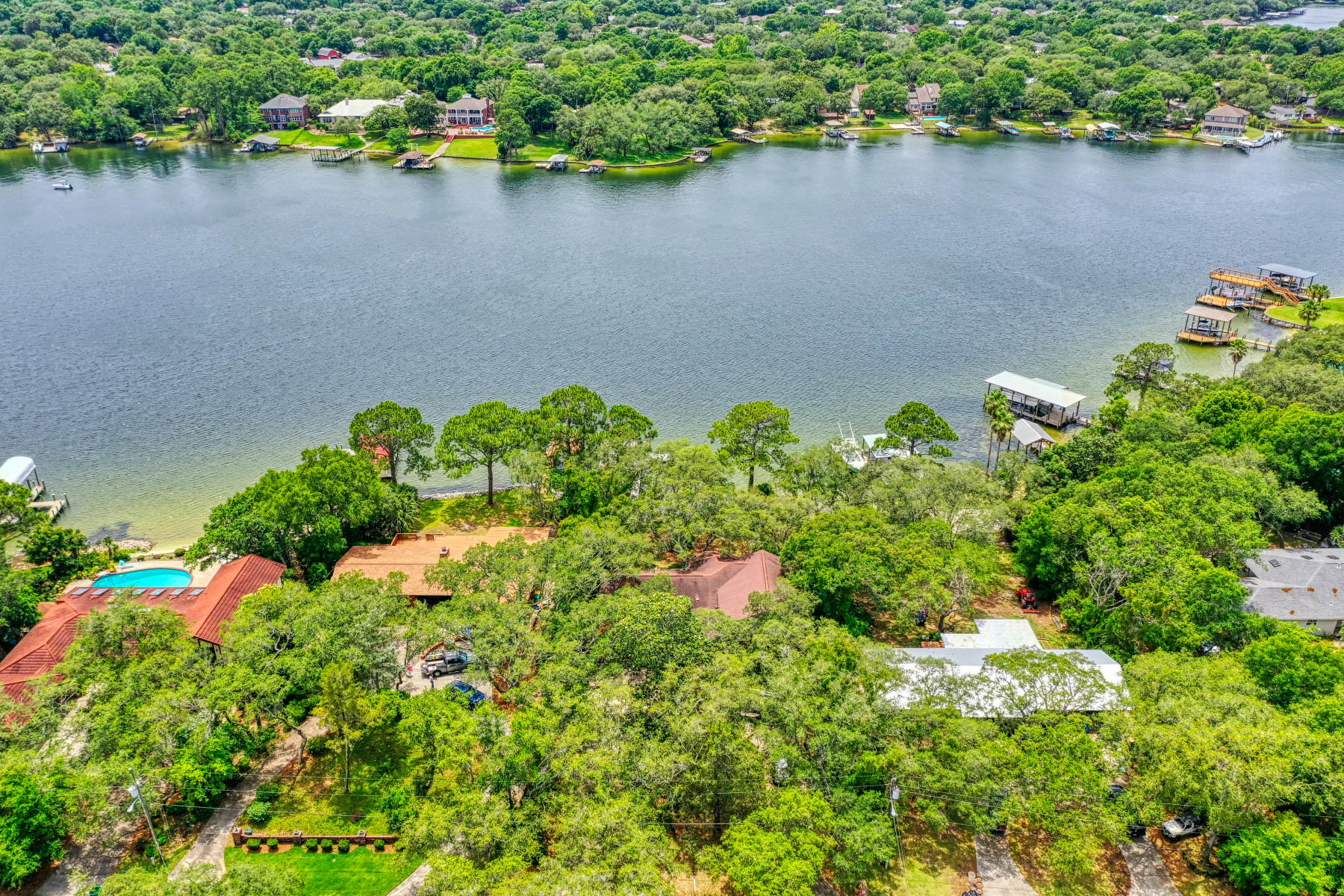 WATERFRONT DEAL!!!! Family-sized home tucked away on a HUGE Beautiful Bayou lot Situated in a desirable neighborhood in the heart of Fort Walton Beach. Well-structured house with Ample parking, round-about driveway,whole house Diesel Generator,Fishing/boat dock with covered roof and SPECTACULAR VIEWS OF THE BAYOU FROM EVERY ROOM!!