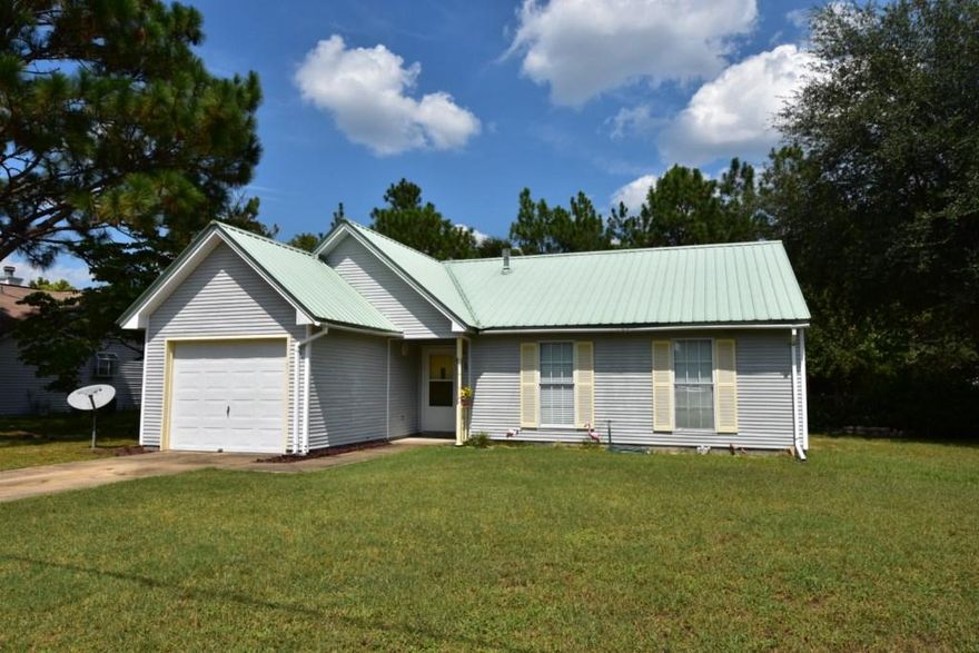Affordable, South of I-10 and seller pays most closing costs! 3 Bedroom 2 Bath home on a level chain link fenced back yard. Tile floors in the Foyer, Living Rm, Dining and Kitchen. Beamed cathedral ceiling accents the Living Rm, Dining and Kitchen. All appliances included, even the washer and dryer! Dining area has a corner bay window. 1-car garage is heated and cooled and a portion has been portioned off for the Laundry Rm-there's still room to park a small car. The SF of 1130 does not include the Laundry area or Garage. The Seller is providing a 1-year American Home Shield basic home warranty, a $405 value for you! Costs paid by the seller does not include: credit report, home/septic inspections, optional points/origination fee, Homeowner insurance and escrow prepaids. See it today!