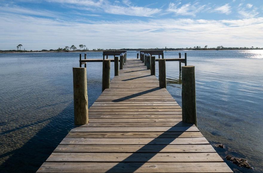 WATERFRONT complex! This 2 bdrm, 1 bath unit overlooks the beautiful courtyard filled with gorgeous oaks just steps to the community pool and 
shallow banks of the Sound. Perfect for paddle boards, kayaks, and spectacular sunrise/sunset views!  The complex offers parking, laundry facilities, elevator, sidewalks, picnic tables and a walking path that leads down to the water where you will find a dock, paddle board and kayak storage, a little ''beach'', and a pretty island across the way! This unit has an outdoor storage closet and double closets in the Master bdrm. Only minutes from Hurlburt, shopping and the emerald coast beaches of Okaloosa Island.  With reasonable HOA fees, water views, and water access like this, you won't want to miss this opportunity for an affordable salt life! The monthly HOA assessment includes water, sewer, trash, pest control and grounds maintenance. BUYER TO VERIFY details.