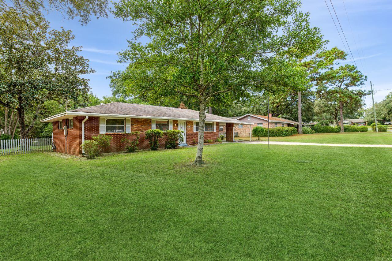 Don't miss this 3 bedroom one bath all brick house near Eglin AFB. This is a well maintained home on a sizable lot. The home includes a renovated bathroom, updated tile in the kitchen and updated hand-scraped laminate in the common areas and two of the bedrooms. The home has a new roof (Dec 21), gutters (July 2020), gas water heater (Aug 2019), 100 Amp panel box (April 2016), HVAC (July 2014). There is a large screened in patio that overlooks the fenced in backyard. The backyard includes a concrete foundation garden shed. On the back side of the garden shed is a second storage room. The laundry room is off the two car carport.