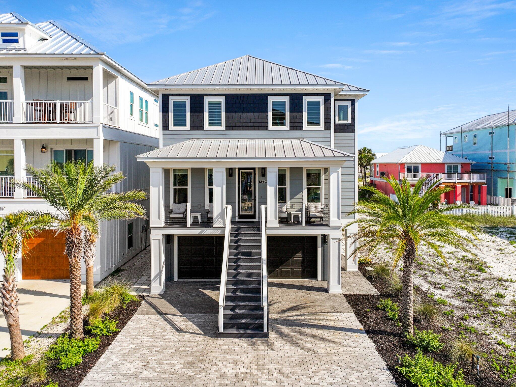 Are you ready to LIVE your best life at the beach?? STUNNING 2020 custom built and meticulously maintained luxury home offers the perfect blend of latest building standards, comfort and beautiful views, making it an ideal sanctuary for worry-free relaxation and entertainment. Located in the Sound front community of Grand Navarre on the west end of Navarre Beach, this home provides views of Santa Rosa Sound with easy access to pristine white-sand beaches and the crystal-clear waters of the Gulf of Mexico. Enjoy the best of coastal living on unspoiled Navarre Beach in this exceptional home. This residence boasts spacious and beautifully appointed living areas designed with both style and functionality in mind. High ceilings, large windows, and an open floor plan create a bright and airy atmosphere, perfect for entertaining guests or enjoying quiet family evenings. The state-of-the-art two island kitchen is a chef's delight, featuring Thermador smart appliances, gas stove, wine cooler, two ovens, warming drawer, quartz countertops, and custom cabinetry. The home includes three bedrooms, each designed as a private retreat with ample space, natural light, and elegant finishes. The master suite offers a spa-like experience with a walk-in closet, a lavish en-suite bathroom with dual vanities, elegant lighting and a large two-head shower. Step outside to your private outdoor oasis, complete with a spacious deck and lush landscaping with automatic lighting. This area is perfect for sunbathing, hosting barbecues, or simply relaxing with a good book while enjoying the gentle sea breeze. This home is offered fully furnished with top-of-the-line indoor and outdoor furniture. It is equipped with modern amenities to enhance your lifestyle, including a custom-designed elevator, Geothermal cooling and heating, energy-efficient foam insulation, smart home system, whole home surround sound, remote controlled window shades, LED lighting, keyless locks, security system and a four-car garage. This home truly stands out in quality.