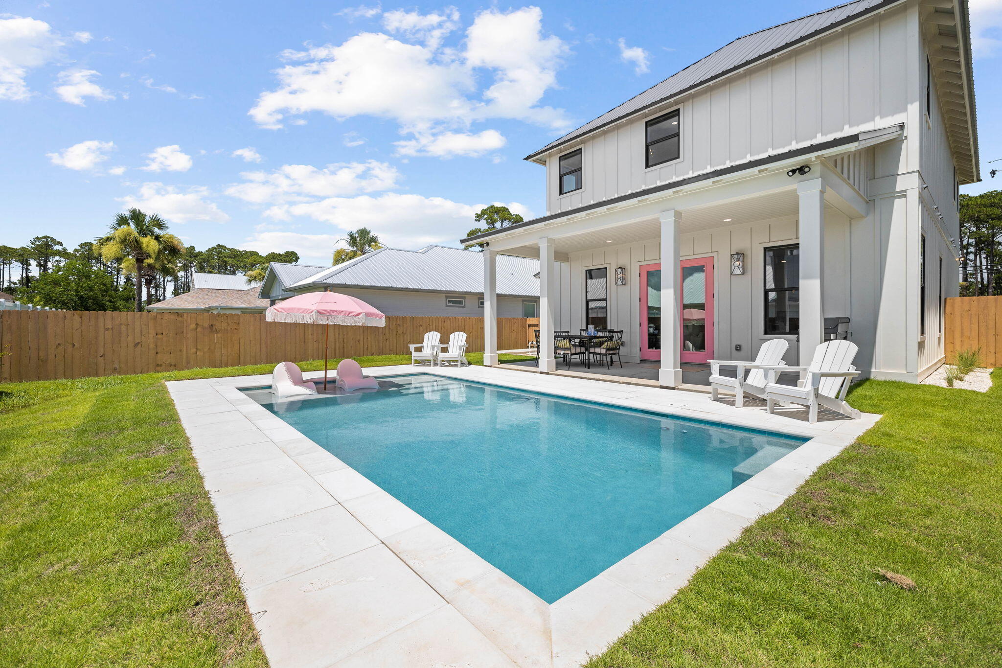 This stunning dream home has been custom built to host an extraordinary experience at the beach. Conveying fully-furnished, this exceptional getaway can be a lucrative investment property with rental projections at $135K annually. Located only six minutes from 30A, this property presents a wonderful floor plan with four bedrooms all having their own ensuite bathroom. This beautifully designed home flaunts a huge private pool, covered back porch & deep garage. The meticulously curated interior has wood-look flooring, large windows, tall ceilings and fabulous finishes. The well-appointed chef's kitchen provides the perfect gathering space on the first level. Enjoy a wonderful meal after a long day at the beach in the delightful dining area or dine alfresco on the covered porch by the pool. This home is offered fully-furnished and rental-ready. Inquire to receive rental income information and estimated expenses for this dream escape by the beach!