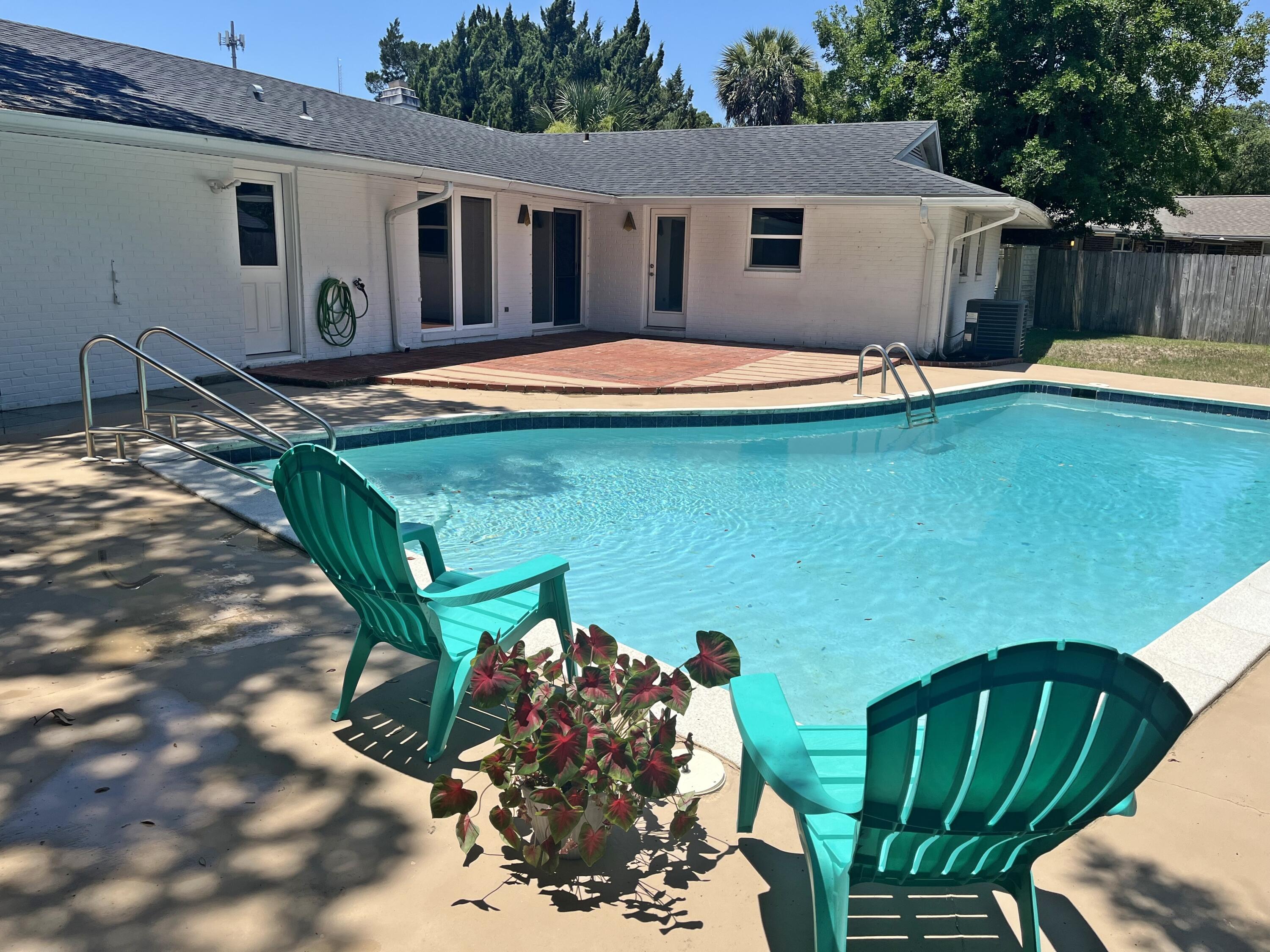 FAMILY FUN AWAITS!  Classic Florida Ranch Style Pool Home in Sought after Kenwood Subdivision! 3 Bedroom / 2 Bath + Bonus Room with Saltwater Gunite Pool w/Heater for Year Round Usage!  Awesome Corner LOT Lined with Palm Trees and your very own Blueberry Bushes.  The Landscaping Wall creates a Private Entrance & Courtyard areas.  Other Features include:  BRAND NEW Wiring / 2024 Hot Water Heater / 2024 Lawn Pump / 2020 Dimensional Shingle Roof / 2018 AC & Heat / Privacy Fenced Back Yard / 2 Car Garage / 2 Car Carport + 1 Car Carport / Fireplace / Double Paned Windows / Sprinkler System / Butcher Block Counters / Nostalgic Parquet Flooring / Pantry / Brick Exterior / Gutters / Sidewalks.  Centrally Located approx 5 Miles from Eglin AFB / 5 Miles from Hurlburt Field and only 5 Miles from the Beach and all the FUN this area has to Offer!!! Close to Shopping / Hospital / Golfing / Playground / Pickle Ball! Buyer to Verify all Dimensions and Information!