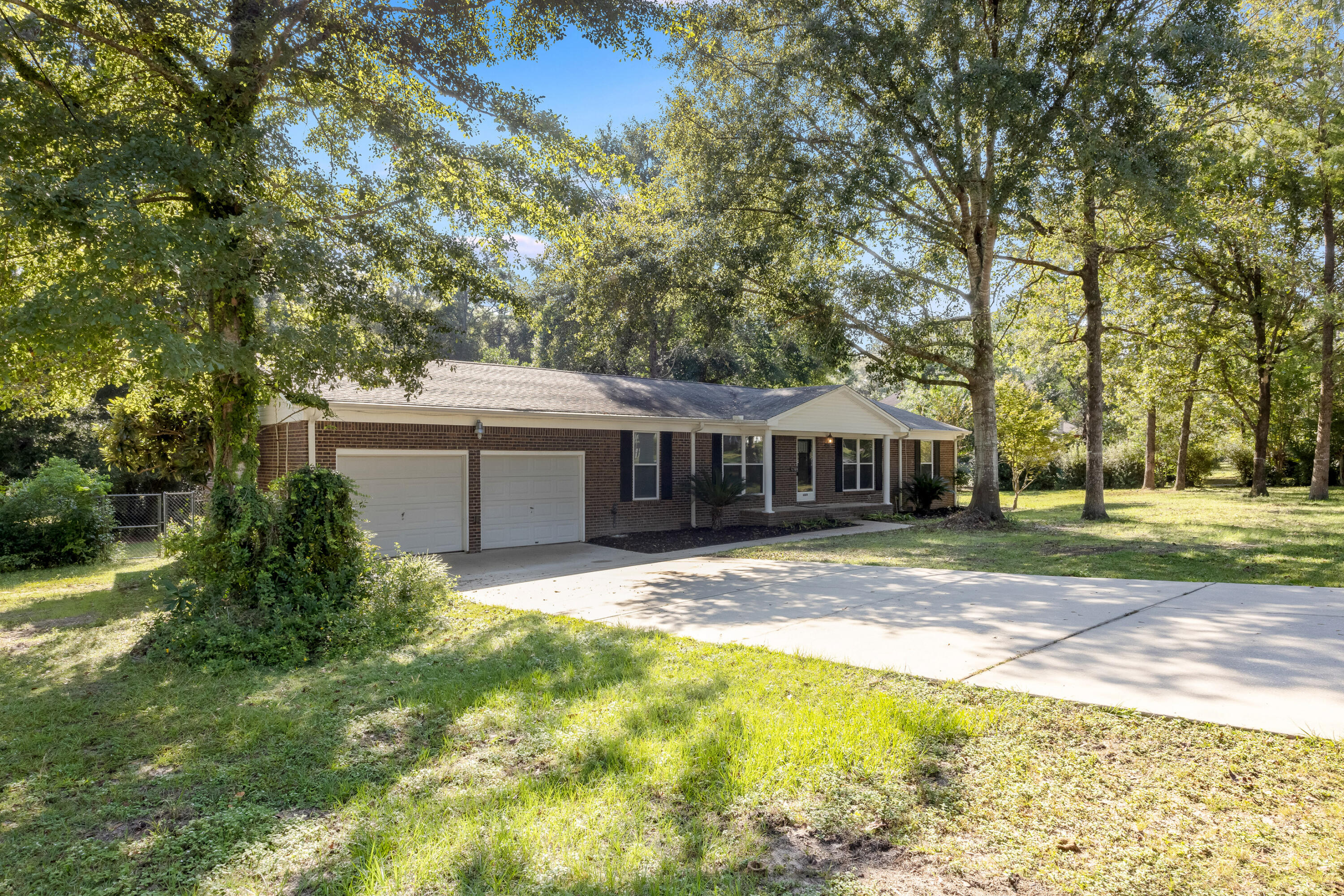 This completely renovated 4 bedroom 2 bathroom home on one acre is waiting for new owners. This property is located in a sought after community and is surrounded by estate homes.  This home offers updated finishes including new appliances, cabinets, countertops, paint, flooring,  lighting, bathrooms, and more. The back porch is huge and just the right spot for enjoying your massive back yard.  A portion of the yard  is fenced.  The two car garage is oversized with a work shop area. There is an addition outbuilding and gazebo toward the back of the property.  The roof on the home is 2017, the HVAC is 2022, and the hot water heater is 2023.