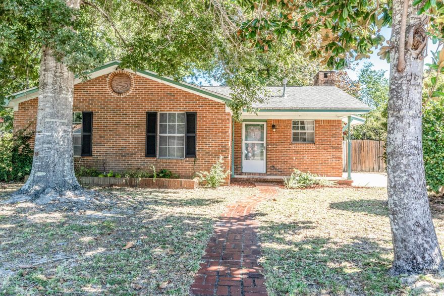 This all brick 3 bedroom 2 bathroom home is conveniently located just minutes from Hurlburt Field, Shopping and Navarre beaches. For sale just in time to take full advantage of the cozy wood burning fireplace! Enjoy your coffee in peace on the13x25' screened in porch. Two story shop located out back is currently used as playhouse up top. Level backyard is enclosed by privacy fence. Call today to schedule your private tour!