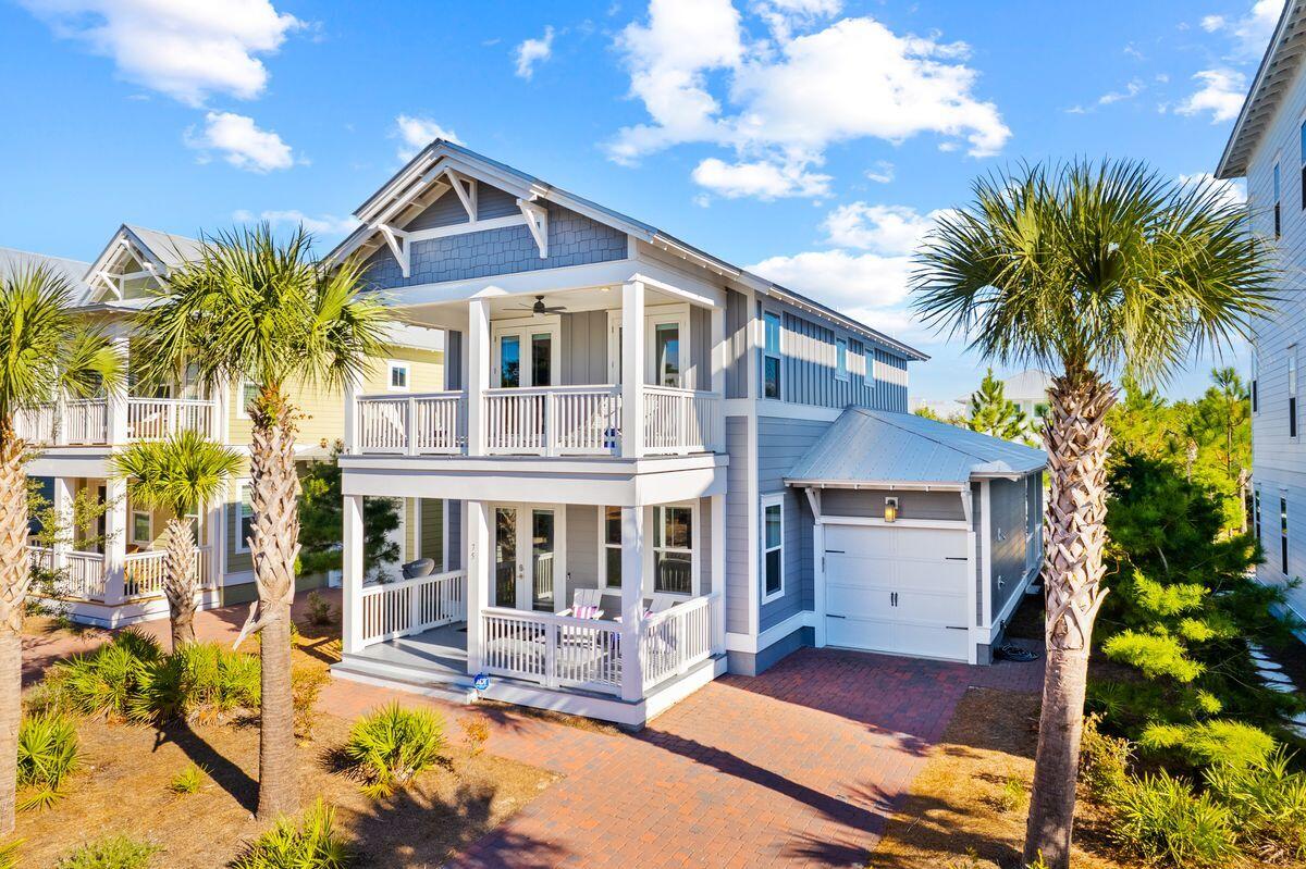 South Side of 30A! This amazing beach home is ideally located in Prominence and is being sold fully furnished with a golf cart. This is the best priced home in Prominence! You will enjoy the large covered porch for grilling and relaxing in the FL outdoors. This two-story home is close to the south side Prominence pool and includes a private garage, bikes and a new 2022 6 seater golf cart. The open living, dining and kitchen have elegant modern finishes. Shiplap covers the lower half of the walls in the living room providing an elegant coastal feel. The kitchen is complete with stainless appliances, white cabinets, quartz countertops, and breakfast bar. The master bedroom is conveniently located on the first floor with a spacious master bathroom. Three additional bedrooms are located upstairs. Two of the bedrooms each have access to the second-floor, covered balcony overlooking this quiet street in Prominence. Enjoy easy access to a beautiful Town Center with shopping and dining, Resort-style pools, Fitness Center and a seasonal Private Shuttle Service to the beaches of 30A. ''The Big Chill / The Hub", the community's town center includes restaurants, shops, and an amphitheater with a covered event pavilion, a cinema screen for movies as well as a stage for concerts and events, all within walking distance. All room dimensions and square footage are approximate and should be verified by the buyer.