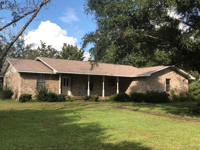 IDEAL Location - 1,7 Mile to Walker Elementary School; 1.3 mi. to Crestview High, .9 Mi. to Post Office - .9 Mi. to PUBLIX and WENDY'S Talk about Location!!!AND, although this home was build in 1986, it was custom built and has been very well maintained. Features split bedroom plan, with good sized rooms, LR with wood burning fireplace. The home was built with roof trusses, so some modernizing will be very easy and make for a wonderful, open plan. There is a 20 X 30 Detached Workshop/Garage with lean-to on back even with sink for washing up - Large 'sittin' front porch The home needs some updating, but well worth doing!