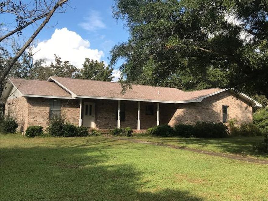 IDEAL Location - 1,7 Mile to Walker Elementary School; 1.3 mi. to Crestview High, .9 Mi. to Post Office - .9 Mi. to PUBLIX and WENDY'S Talk about Location!!!AND, although this home was build in 1986, it was custom built and has been very well maintained. Features split bedroom plan, with good sized rooms, LR with wood burning fireplace. The home was built with roof trusses, so some modernizing will be very easy and make for a wonderful, open plan. There is a 20 X 30 Detached Workshop/Garage with lean-to on back even with sink for washing up - Large 'sittin' front porch The home needs some updating, but well worth doing!