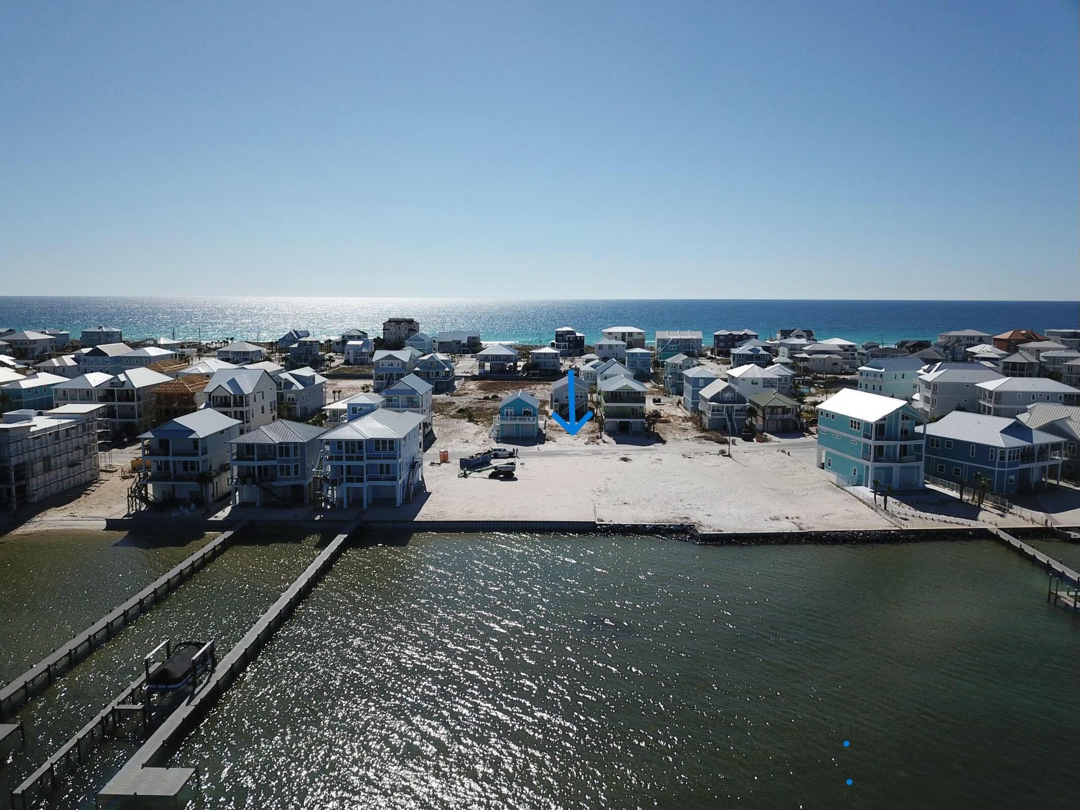 BRING ALL OFFERS!! Motivated Seller!! Incredible Opportunity on Grand Navarre Blvd - Your Dream Beach Lot Awaits! Don't miss your chance to own a prime lot on the western end of Navarre Beach! This exceptional property offers breathtaking views of the Sound, year-round sunsets, and easy access to the pristine beach. The lot is spacious, providing the perfect canvas for your dream beach house, with plenty of room for outdoor living areas and a pool. Located in a charming neighborhood with no HOA and no rental restrictions, this property is ideal for personal use or as a potential home vacation rental. Enjoy water activities, natural beauty, and a laid-back community. This is your opportunity to invest in one of Florida's most desirable coastal locations!