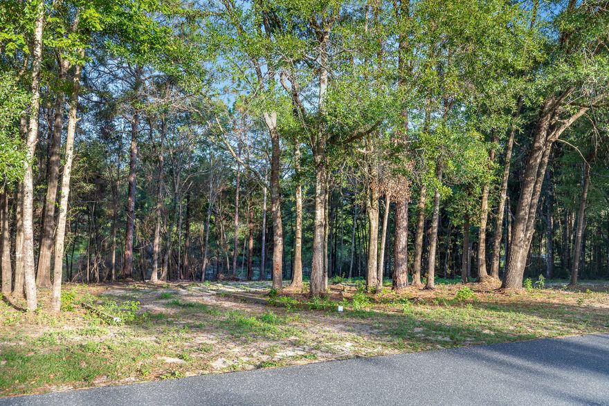 This beautiful and spacious lakefront lot (almost an acre) is already a work in progress for your new dream home/vacation home. This property has a current boundary survey and has a large clear building site with a horseshoe driveway from sideline to sideline. Located just minutes from downtown Crestview on a no through traffic street, and 'No HOA fees'. NO MOBILE HOMES ALLOWED. Zoned Low Density Residential, perfect to enjoy the many benefits of living around nature but with easy and close access to nearby Military bases, shopping centers, many outdoor activities, and the beautiful white sand beaches of our Emerald Coast.