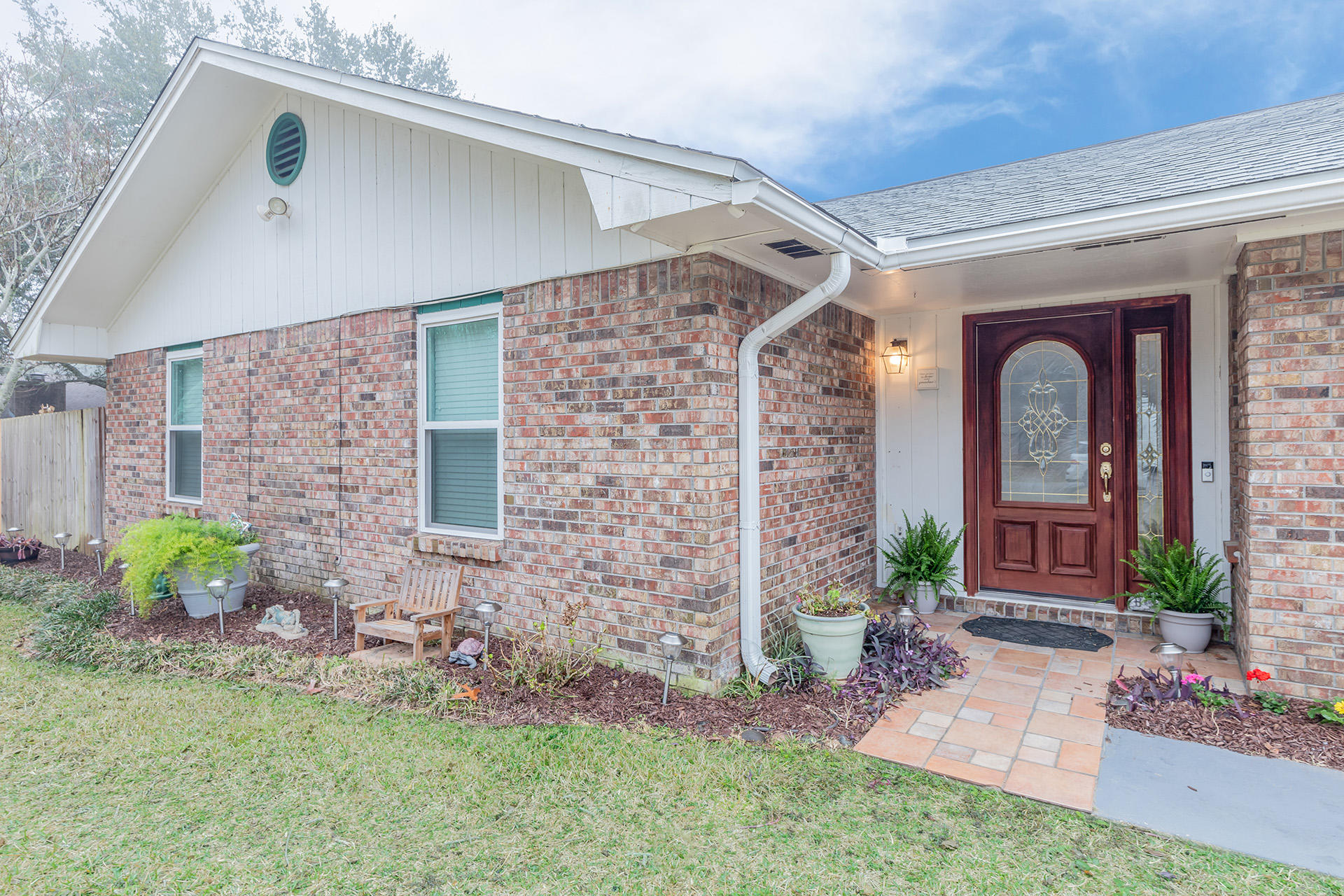 Excellent neighborhood and recent updates make this one-story 3 bedroom, 2 bath home with an in-ground gunite pool an absolute must have. Located in sought after Bluewater Bay with nature trails, plenty of room to walk, golf and explore. This flowing floor plan with large living space features a lovely brick wood-burning fireplace. The kitchen was recently remodeled with stainless steel appliances, to include solid surface counter tops with an enormous pantry for all of your storage needs. Breakfast nook just off the kitchen looks out the French doors to the picturesque backyard. Both additional bedrooms are generous in size with nice closets. The master bedroom has new carpet (2019) large walk-in-closet. Enormous backyard which has a privacy fenced with with mature palm trees, flowering