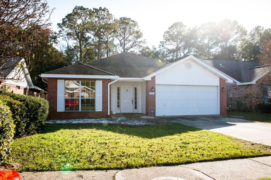 Remarks: Recently reduced! Beautiful home near Hurlburt Field Air Force Base. Lovely tile foyer leads to an open floor plan with vaulted ceilings. Large living room has an elevated plant shelf, fireplace and is perfect for entertaining on those cool nights sitting in front of your fire. The light and bright kitchen with laminate flooring & center-island is designed for serving when you have guests. Large windows with faux wood blinds open up to a lush view of trees beyond the privacy fence. Contemporary chandelier offers excellent lighting in your adjacent dining area. You will love the split bedroom floor plan. Double vanities, garden tub and separate shower create the ideal layout in your future master bathroom. The master bedroom features a large walk-in closet.