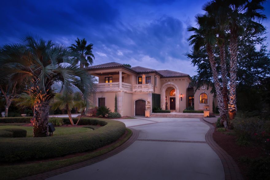 ONE OF THE BEST WATERFRONT VALUES IN THE DESTIN, FLORIDA MARKET! L.O.M.A. Letter! This unique home combines an incredible number of desirable features in one luxurious property! Enjoy the best of many worlds: the classic grace of Mediterranean style combined with the convenience of modern technology, spacious dimensions well designed into intimate gathering places, the peace of mind that comes from solid construction finished with the appeal of elegant craftsmanship, and a peaceful, private location that also makes a fabulous backdrop for entertaining!
The property's beautiful setting along a bayou leading to Choctawhatchee Bay... ...is enhanced by the entire footprint of the home and extensive terrace that is graded to provide protection from inclement weather and give better views of the surrounding nature preserve. Built like a fortress, the home consists of poured concrete reinforced with steel, finished with stucco, and Pella exterior doors and windows. The large circular driveway with ample parking leads to the front porch and two-story portico with limestone arch. From the front foyer, the natural flow works well for everyday living or entertaining. The formal living room features a high coffered ceiling, elegant gas fireplace, and fabulous views to the back terrace and bayou. The adjoining formal dining room is linked to the kitchen by a butler's area and bar. The unique aged-look of the walls comes from canvas being custom painted in an artisan's studio and then affixed. Main area floors are 3/4" French Carton and doors are solid mahogany. The contemporary kitchen features limestone and stainless countertops, beautifully designed honeycomb onyx backsplash, and top-of-the-line appliances including a Gaggenau 6-burner gas stove, hidden microwave, large Subzero, new icemaker, and 2 new dishwashers.

For casual gatherings, there's a spacious family room off the kitchen which connects to a fabulous outdoor kitchen via sensory-activated sliding glass doors. Recently upgraded, the summer kitchen features a gorgeous copper hood over backsplash with a waterfall and LED lighting, honeycomb onyx counters, and new stainless fridge, icemaker, and grill. Outdoor cooking is only one reason the highlight of the home may be the extensive back patio and terrace. The pool/spa is another high-tech wonder. Up to 14 people can enjoy soaking in the hot tub in cool weather, or cool it down for a refreshing dip on hot days. A push of a button turns it into waterfall or fountain and adds colored lighting. With plenty of room for sun and shade, elegant nighttime parties, or a relaxed family reunion, you'll enjoy outdoor living year-round.

Occupying its own wing, the first floor master suite is a true oasis. The huge bedroom offers waterfront views, a custom-painted curved trey ceiling, electric blinds, and disappearing television. The rest of the suite includes three fabulous walk-in closets, a jetted tub, dual sinks, and large multi-head shower. A guest room and climate-controlled storage area are also found on the ground level, while three additional bedrooms, two baths, and a media room/guest lounge area are located upstairs.

The terrace overlooks the back lawn, which slopes down to 127' of waterfront on a deepwater bayou. Enjoy the incredible setting surrounded by a nature preserve and with hardly any boat traffic, yet within just few minutes of all the active water sports of Choctawhatchee Bay and the Gulf of Mexico! The fully equipped dock will house a 30' boat and lift up to 10,000 lbs. Along with space for up to 3 cars, the garage has a separate golf cart door. Pets even have their own entry doors, covered porch, and gated side yard. Real copper downspouts and gutters prove that no corners were cut on construction - and it's all protected by security cameras filming 24/7! Other conveniences include keyless entry, 2 new HVAC units, a new generator, central vac, extra W/D hookup, and LED low voltage lighting throughout the home. 

The fabulous location gives you the option of intense privacy and quiet or abundant activity and socializing, as you see fit. Regatta Bay's amenities, including a large swimming pool, tennis, playground, clubhouse, golfing, and manned entry are nearby, and the central Destin location is perfect for enjoying the best restaurants, shopping, and activities of the Emerald Coast! Chandelier in foyer does not convey.  Seller may entertain a partial trade-in from a Buyer for a lot or condominium valued at $750,000.00 or less.  Buyer must verify all information and specifications.