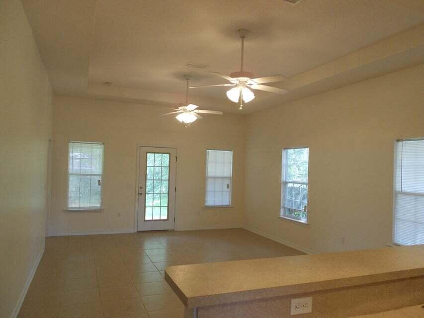 High ceilings add to the light and airy feel. Large living room opens to the 16 x 10 covered porch. Kitchen has a breakfast bar and pantry and is highlighted by a sky light. All three bedrooms have large closets with the master closet being 8 feet deep. Dual vanities in both full baths. Inside laundry unit. One car garage.