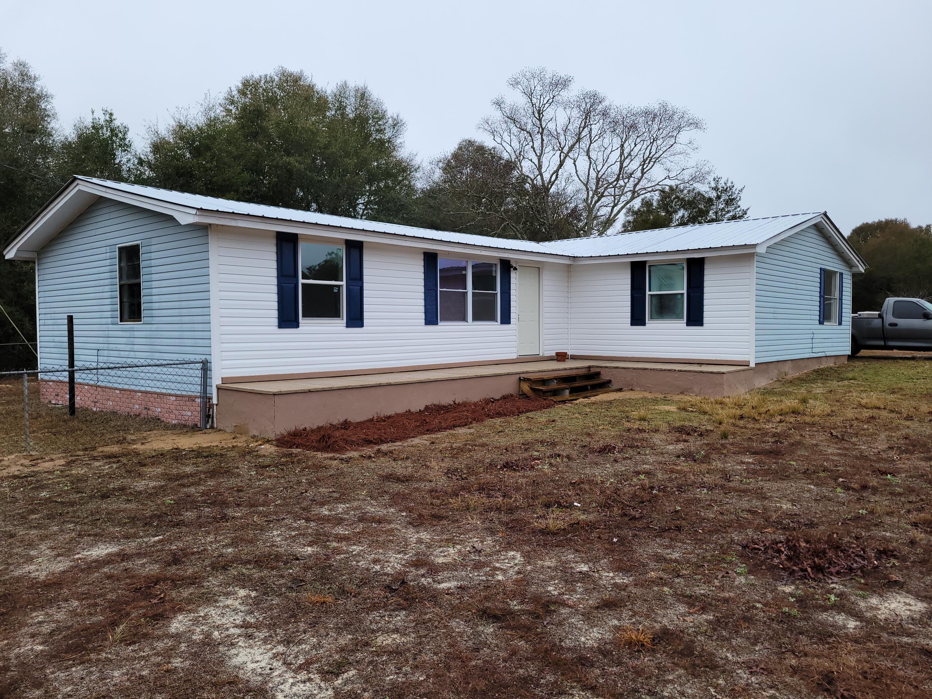Completely Remodeled. Great property with a 2 car garage, and living room and bedroom addition. 2.3 acres all cleared. Ready for all your farm animials or ATV's! NEW HVAC, Flooring, Painting, Bathrooms, Lighting, Appliances, Fenced in Yard. Relax with quiet country living but near Hwy. 90 and either Niceville, Defuniak Springs or Crestview or the white sugar sand beaches!