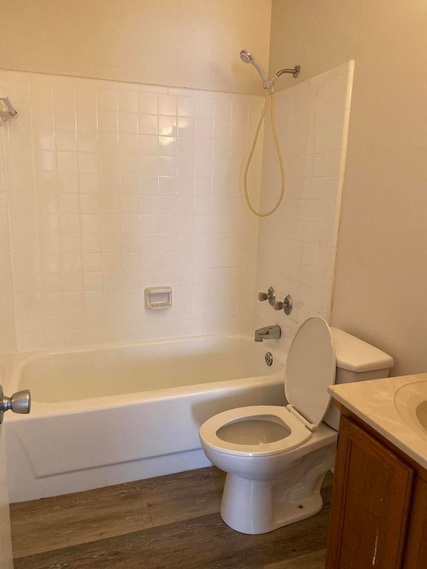 Newly renovated end unit apartment to include new luxury vinyl plank flooring, new ceiling fans, new paint, new refrigerator. Utility room with washer dryer connections.