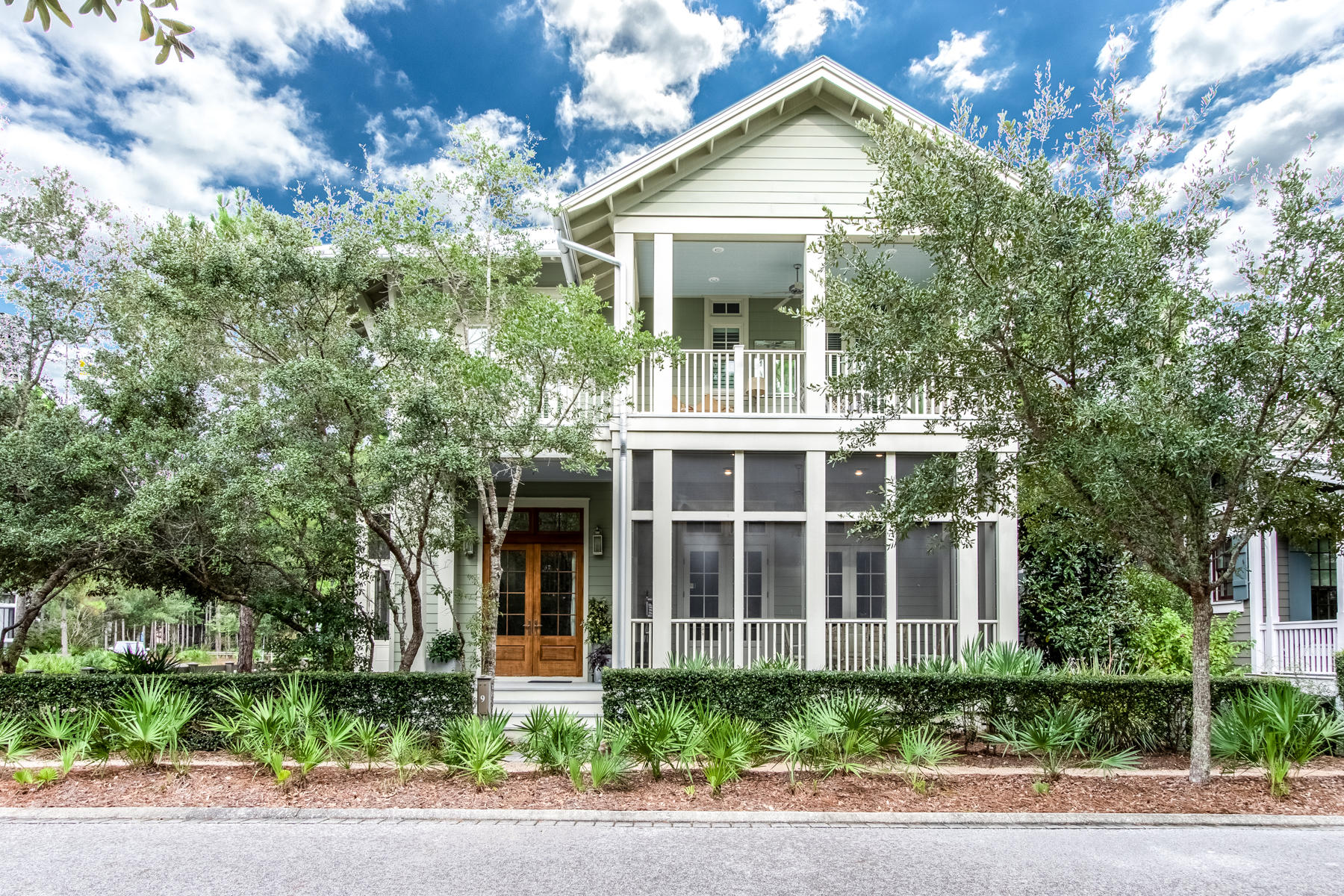 Situated on a corner lot, and overlooking a lovely pocket park, this home is conveniently located in Camp District of beautiful Watercolor Resort. This five-bedroom plus bunk room, 4.5 bath home was built in 2014 by Boyd Martin offers 3,114 SF of finished space and almost 1,000 SF of porches. Upon entering the home, you will love the spacious open-concept design, abundant windows, 12ft ceilings and a front and side screened in porch which add to the indoor living space. Special care was taken to select the interior finishes which include beautiful reclaimed floors throughout, door frames and main wall in downstairs master bedroom all from a Tobacco factory, marble kitchen countertops, custom cabinetry, solid core interior doors, 2 master suites, 12 ft ceilings on the 1st floor, 11ft..