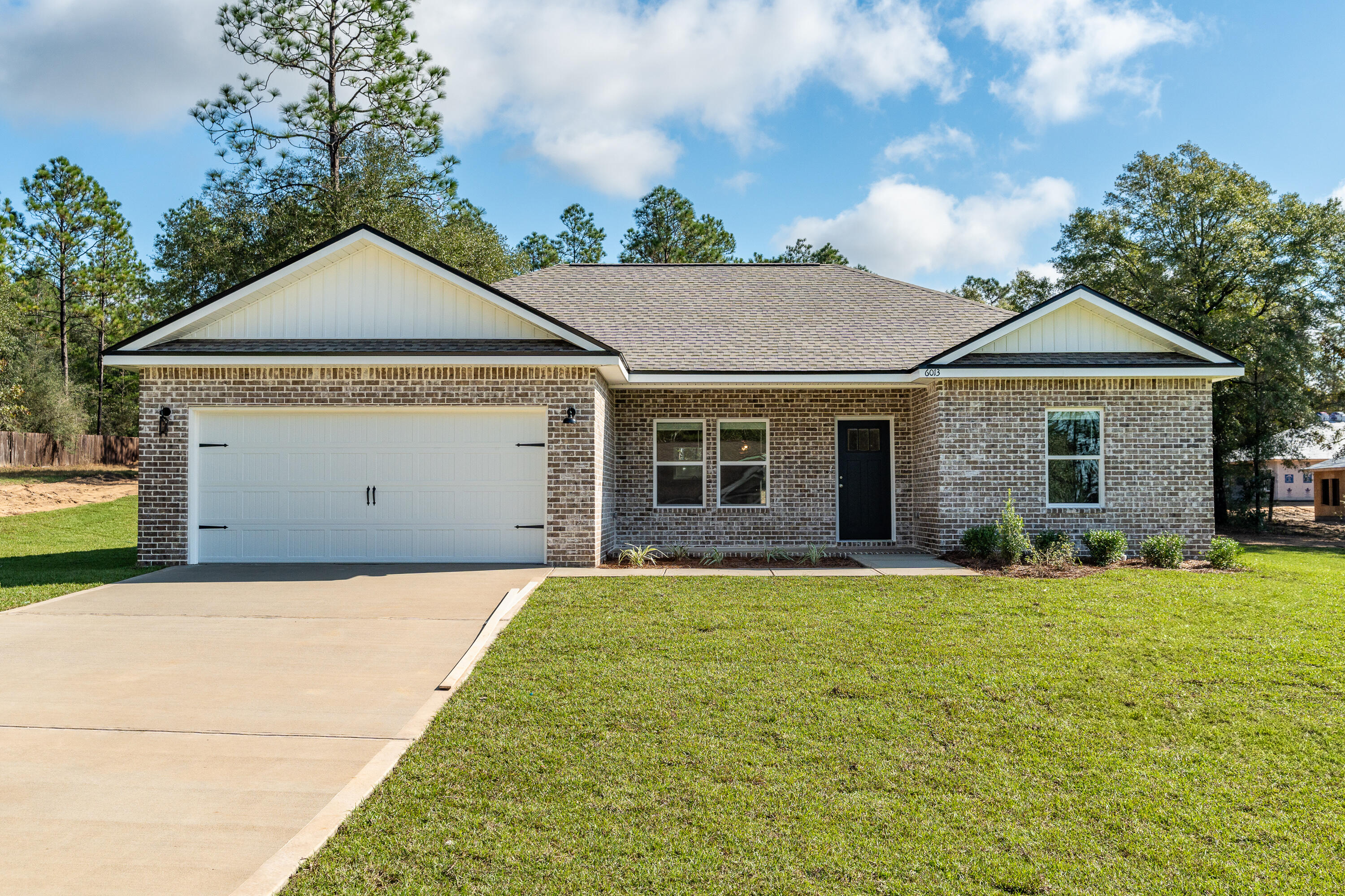 READY IN MARCH - HALF ACRE - ALL BRICKCovered front porch opens to generous size family/dining/kitchen area with recessed lighting and raised ceilings.  Kitchen has work island w/bar seating, stainless steel appliances, quartz or granite countertops and pantry.  Split bedroom plan with owner's bath having walk-in closet and double vanities.  Builder will contribute up to $10,000 towards buyers closing costs and/or prepaids and/or rate buydown - restrictions apply - call for details.  Photos of similar completed home - selections - elevations will vary-buyer to satisfy themselves to anything they deem pertinent.  There is still time to make some selections and/or upgrades from builder samples - call for details.