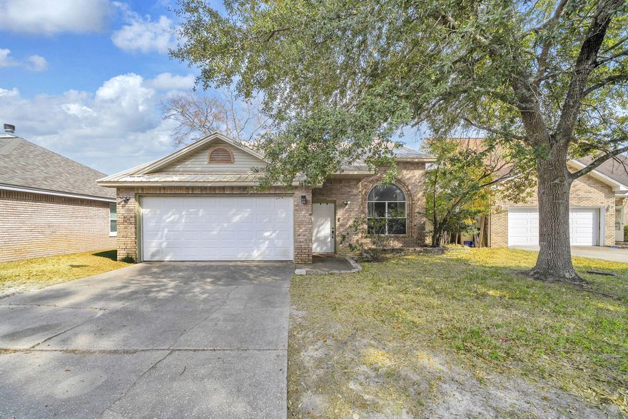 CULDESAC HOME IN THE HEART OF FORT WALTON BEACH!  Looking for a very short commute to Hurlburt Field?  This lovely home is less than 15 minutes to the base!  Come see this 3 bedroom, 2 bathroom, 2 story home centrally located near the bases, shops, restaurants and of course, the beach which is less than 7 miles away.  Big ticket items are done...new metal roof in 2015, water heater in 2021 and HVAC system installed in 2025.  Inside is a spacious living room with vaulted ceilings and fireplace, open to the kitchen and dining area.  Looking for a playroom or home school room?  The sunroom directly off the kitchen provides a bright living space with doors out to the backyard and patio.  The fully fenced backyard is perfect for your pets. The bedrooms are split with a main floor master and two bedrooms and a bathroom upstairs.  The master has an enormous walk-in closet and attached master bath.  One of the spare bedrooms has a walk-in closet as well.  Off of one of the spare bedrooms is a walk in attic with plenty of room to store your decorations.  Bonus features of an attached two car garage on a cul-de-sac location make this house a must see!  