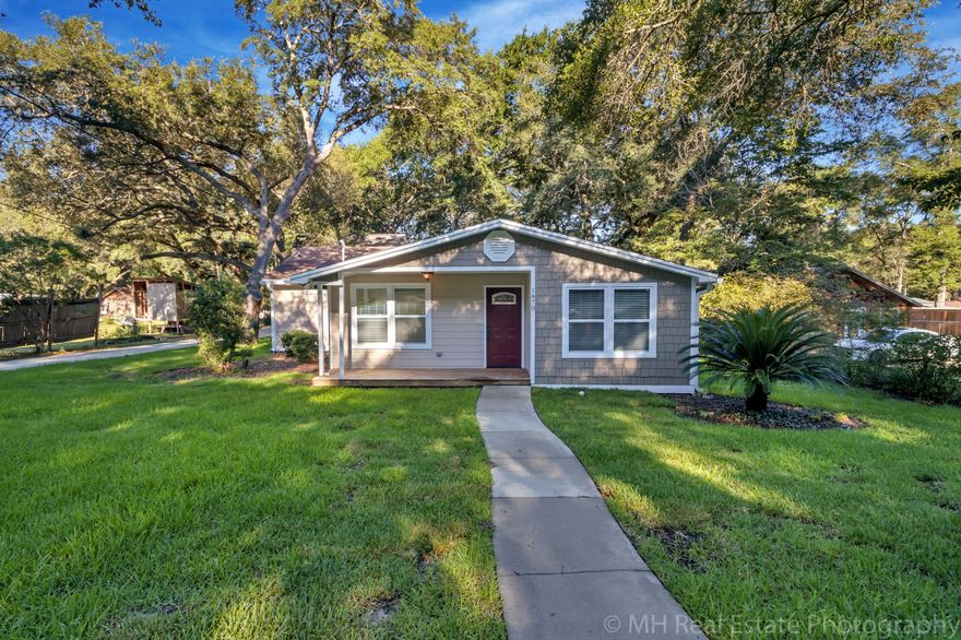 Available now is this Cottage home (1,488 SF) w/ 3 bedrooms, 2 bathrooms and an office on a large lot in central Niceville. PLUS, there's an INCOME PRODUCING detached oversized 22'x28' garage with upstairs 1 bedroom apartment or MOTHER IN LAW SUITE. The main home is fully remodeled including hardwood floors w/ porcelain tiles in the wet areas. The kitchen features GRANITE counters and stainless steel appliances. This open concept floor plan features vaulted ceilings and tons of natural light. The master suite also has a vaulted ceiling and the bathroom boasts double vanities, corner soaking tub, tiled shower w/ dual shower heads and a walk in closet. The cozy garage apartment (532 SF) has laminate wood floors, 9 foot ceilings w/ recessed lighting and an ''above the trees'' feel.