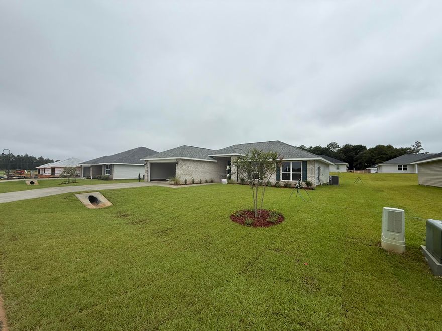 This 4/2 has a lot to offer!  Good sized lot, fully sodded yard and professionally landscaped.  The 2-car garage comes with electric garage door opener.  The house is 3-sided vinyl with a brick front.  This is a split bedroom plan.  There is a dining area off the kitchen.  All floors are carpeted except wet areas which have LVP.