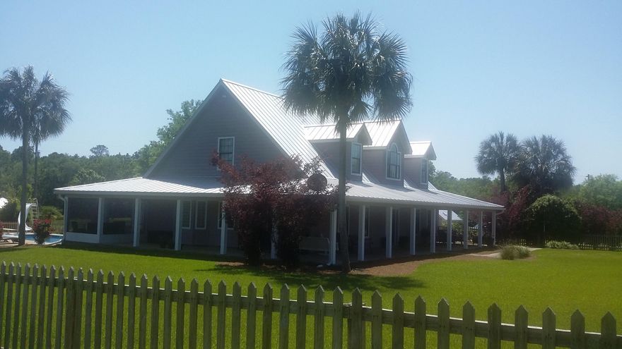 67 acres, with 2 ponds and your Dream Home!  Perfect location for the kids or grandkids complete with a 3,235 s.f. heated and cooled home with 6,196 s.f. under roof with porches and extras. This two story home built in 2003 has meticulously been maintained and taken care of.  Has large master bedroom and  master bathroom downstairs, with beautiful bath with jet tub, large double door walk-in shower and private commode closet. Own exit door to the back porch for that morning coffees that overlooks the pool.   Two (2) upstairs bedroom and extra Bonus Room.  Downstairs includes a spacious living room with gas fireplace and Cathedral ceiling, kitchen is a  ''Chef's Delight' with granite counter tops, island and hi-end appliances  CLICK ON MORE TO CONTINUE READING