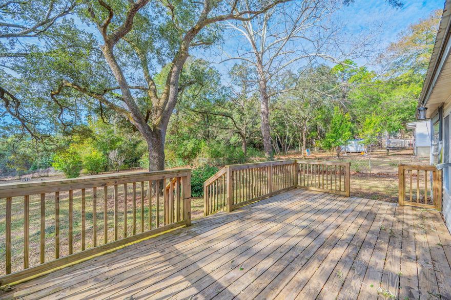 Set on a flat, half-acre lot shaded by gorgeous mature oak trees, and backing up to military land for privacy, this updated single-family 3/2 home gives space! Perfectly positioned near military bases and sought-after A+ schools, making everyday life beautiful. Versatile spaces such as indoor laundry, bonus enclosed garage, sun-room and attached workshop are not included in square footage, making this home big on space! Home has been refreshed with neutral flooring, no carpet! Scraped ceilings, no popcorn! Fresh paint, granite counters, and updated baths. Out back, the exterior deck invites gatherings under the trees, while the yard building provides room for projects and storage. Boasting a metal roof, newer water heater, newer appliances, full Electrical re-wire, lawn pump and NO HOA, bring your boat or RV and make it your own. 