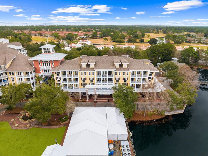 SELLER FINANCING OFFERED WITH 20% DOWN. Situated in one of the most sought-after buildings in Baytowne, this well-planned three-bed, three-bath condo can be used as a two-bed luxury apartment with a separate studio lock-off. The generous balcony directly overlooks the stage and charming Village of Baytowne Wharf. Look forward to grandstand views of the summer fireworks and live music events from the privacy of your own home. Ideal as a second home or rental investment, this beautiful condo boasts LVP wood floors, updated bathrooms and an awesome kitchen with distressed cabinets, granite counters, stainless appliances and a social breakfast bar. The sunny open living space seamlessly blends the tastefully furnished sitting area with a formal dining area for entertaining.