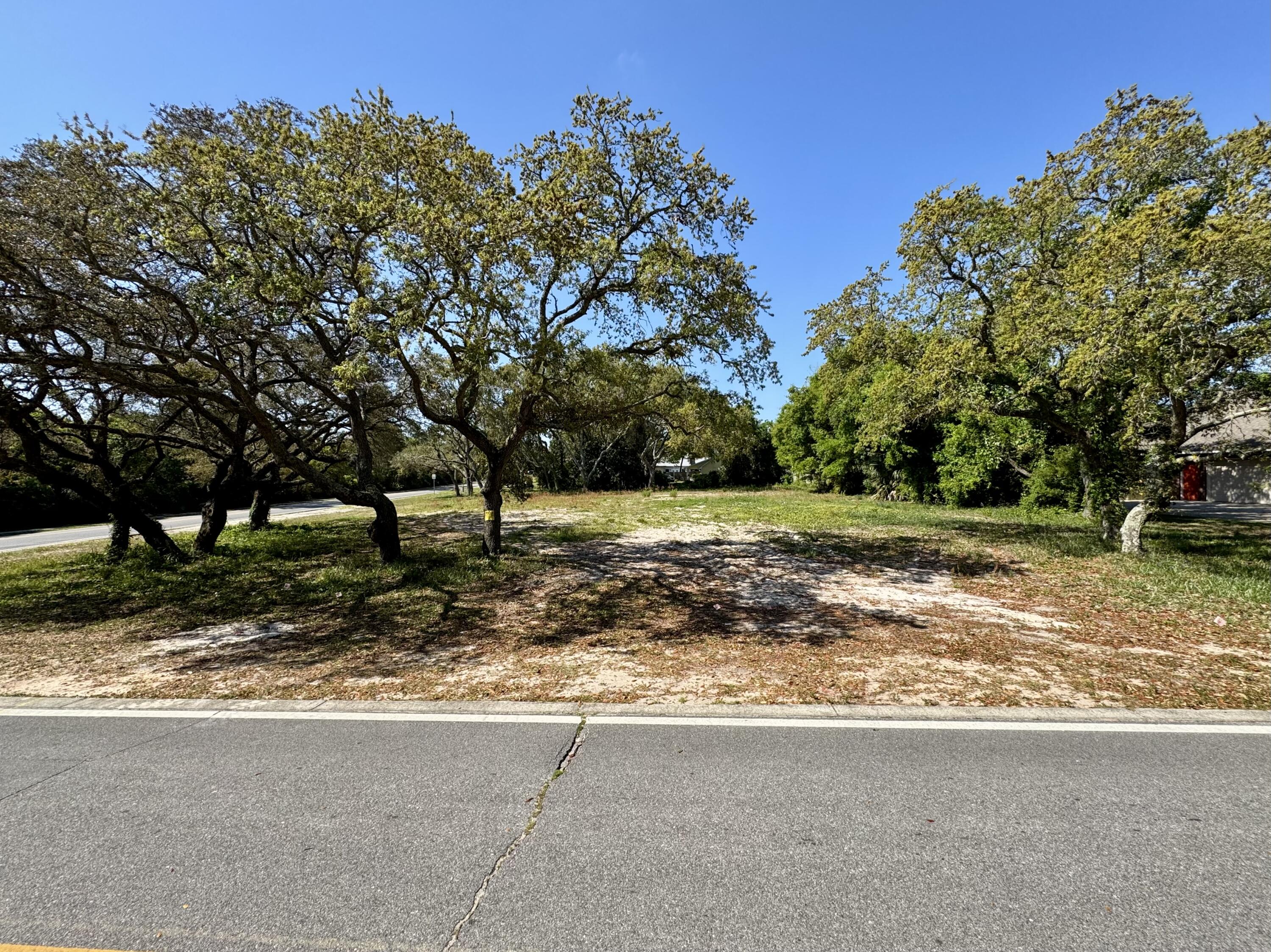Location is everything, and this vacant lot offers one of the best in Destin! Ideally situated across from the beautiful Choctawhatchee Bay, this fully cleared homesite is nestled on one of the most desirable streets in town. With mature trees perfectly framing the property, it's the ideal canvas to build your dream home. Conveniently located near top-rated schools, shopping, dining, world-class fishing, and, of course, the beach - this is a rare opportunity you won't want to miss! SELLER WILL LOOK AT SELLER FINANCING OFFERS!