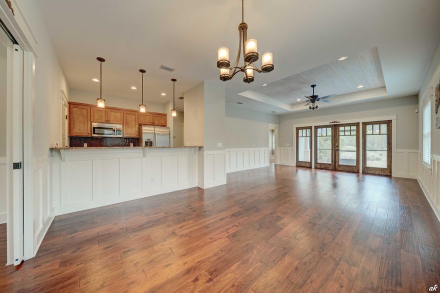 UNDER CONTRACT WITH CONTINGENCIES; SELLER ACCEPTING BACKUP OFFERS.Brand new exterior paint and brand new HVAC.Looking for a private oasis to call home with luxurious amenities at your fingertips including access to serene Lake Powell, a lakeside pool and fire pit, nature trails and Greg Norman designed Shark's Tooth Golf Course? This terrific 1,505 sq ft 3-bedroom, 2-bath home is located on the third fairway of Norman's Shark Tooth Golf Course in Wild Heron, a prestigious gated golf community. The home has a beautiful paver stone entry and driveway with a 2-car garage. Upon entry you are greeted with custom hardwood floors throughout the main living areas & tile floors in the kitchen and bathrooms.