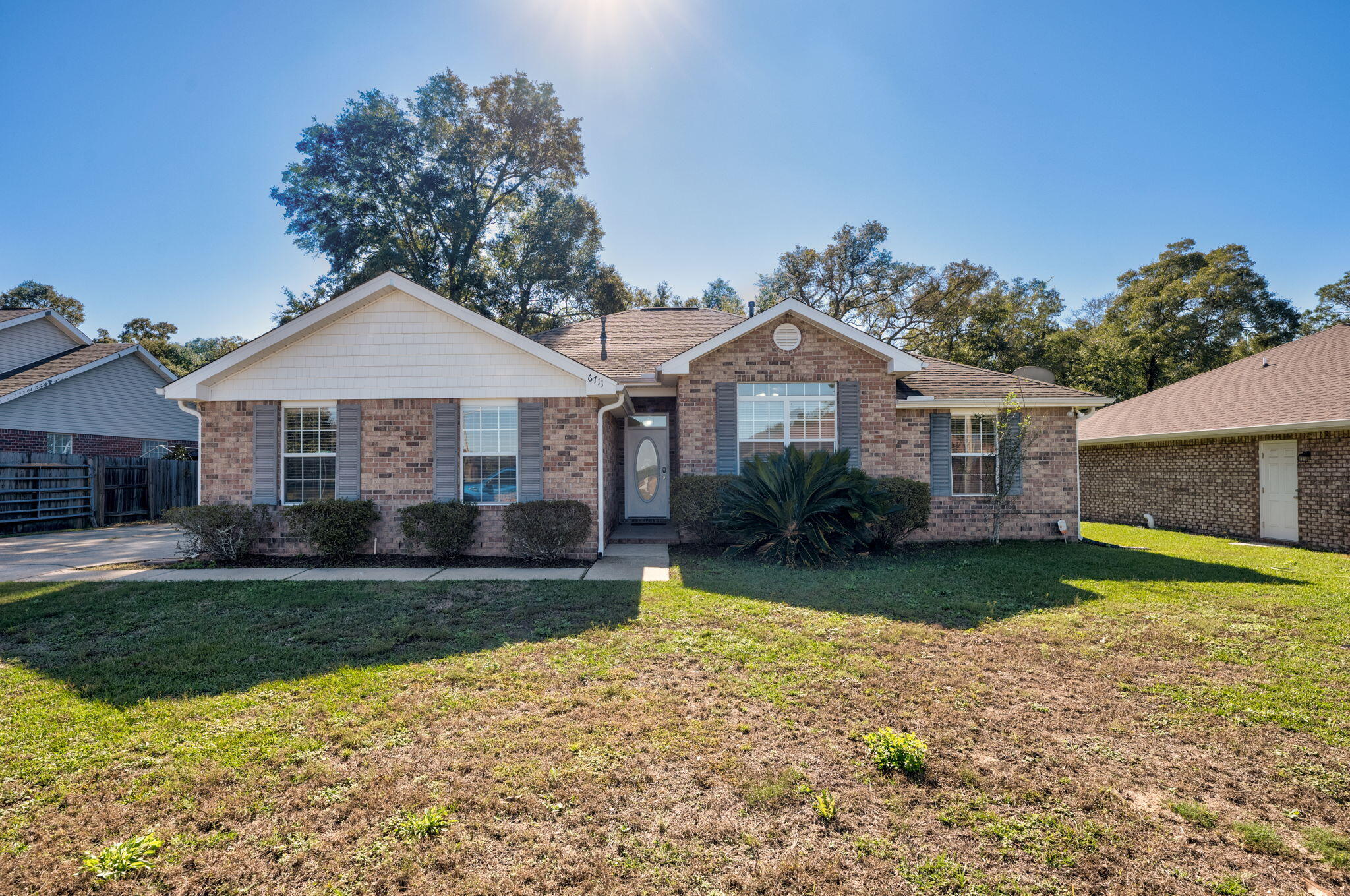 Welcome to quiet and serene Ventura Estates in Milton, FL! This 3-bedroom, 2-bathroom property has a large, spacious privacy-fenced backyard with a parking pad suitable for boat, RV, golf cart, or extra car parking! Step inside to find high ceilings throughout! Just off the main living space, you'll find the kitchen is equipped with brand-new appliances, a convenient pantry, and a cozy breakfast area, ideal for your morning routine. NEW laminate countertops were installed in November 2024 not only in the kitchen, but both bathrooms as well, adding a fresh, modern touch to the space. From the kitchen, enjoy easy access to the beautiful backyard, where lush greenery and ample shade create a peaceful place perfect for pets, kids, or entertaining friends and family. The Primary bedroom with ensuite bathroom is a split floor plan, separating it from the other two bedrooms in the home, allowing the perfect level of privacy. Just one mile from Bagdad Boat Launch on Blackwater River, this property is in the perfect location for all outdoor activities! Don't miss the opportunity to make this delightful house your next home!