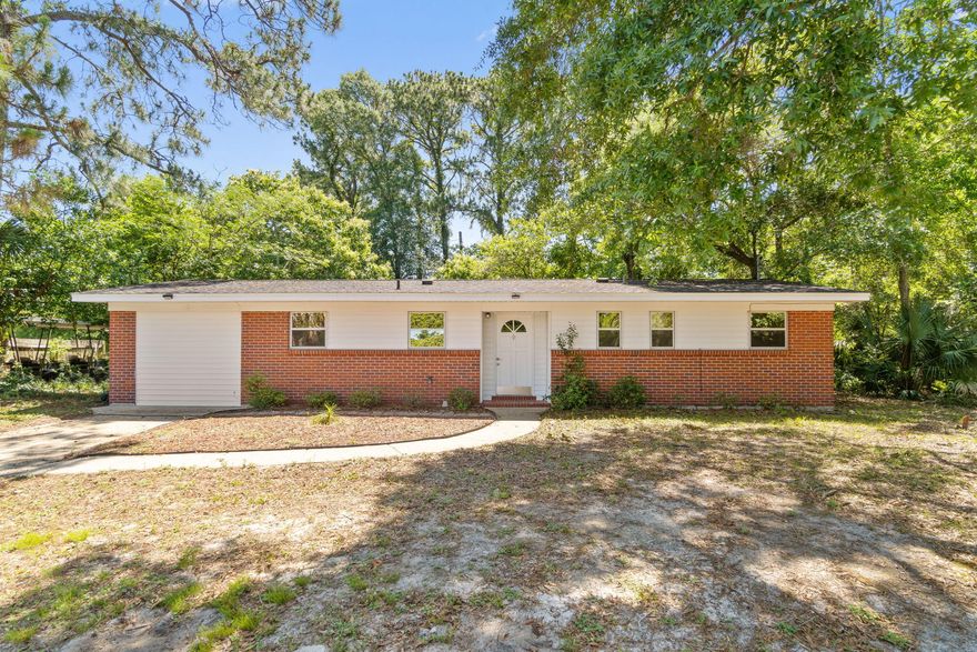 Welcome to this renovated beautiful solid brick ranch home in the Garniers Beach area of Fort Walton Beach. In addition to the 3 bedrooms, 1.5 baths enter through the french doors and there is a large bonus family room from the converted garage and a 16x32 outbuilding with electricity in the backyard that will have a new roof on it prior to closing! It can be a workshop or a hobby building or serve as a garage! The roof on the main house was installed in 2015 and a new HVAC will also be installed prior to closing! When renovated in 2015 the home was repainted with neutral colors and also got new fans and light fixtures, new floors, new window blinds, new kitchen and bathroom cabinets, countertops, sink, and faucet and disposal. From the kitchen and eat in kitchen space there is a spacious living room with sliding glass doors which leads to the fully fenced in backyard where you'll even find a producing fruit tree! Enjoy visits from the friendly neighborhood ducks which live at the pond behind the home. Welcome home!