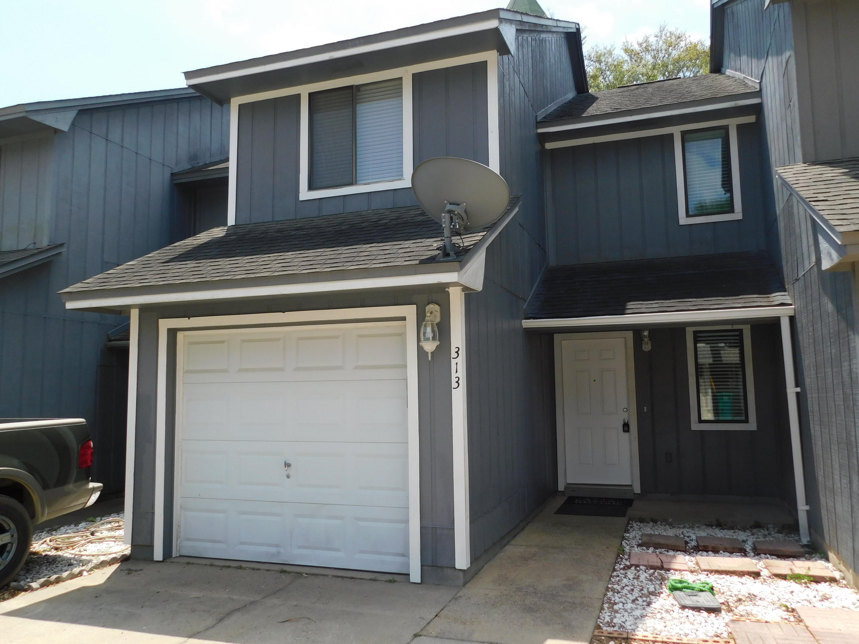 Well maintained town home centrally located between Eglin and Hurlburt. Walking distance to both high school and middle school and across the street from the new Fort Walton Boys and Girls Club facility. This townhome features a wood burning fireplace in the carpeted living room, an open design kitchen with wood stained cabinets and tile flooring. A half bath is also located on the first floor along with access to your own private garage. Upstairs you will find the laundry area, two large carpeted bedrooms with a full bathroom located between them. This home has been freshly painted and move-in ready!!!