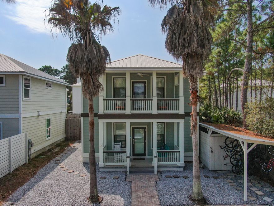 Well maintained 4 bedroom/3 bathroom being sold fully furnished! This Blue Mountain Beach home is a prime opportunity for a vacation rental home, or a primary or secondary residence. Very convenient location with proximity to multiple  beach accesses and multiple dining and retail options. The outdoor living space offers multiple spots to entertain with a rocking chair front porch/up stairs balcony and a fully fenced in private back yard! The downstairs, open concept floor plan, features a large living area, dining area, and kitchen with bar. There is also a bedroom on the first floor with a full bathroom. There is an oversized owner's suite upstairs as well as a secondary bedroom, bunk room and an additional third full bathroom. There are 3 owner's closets and a stocked shed with bikes!