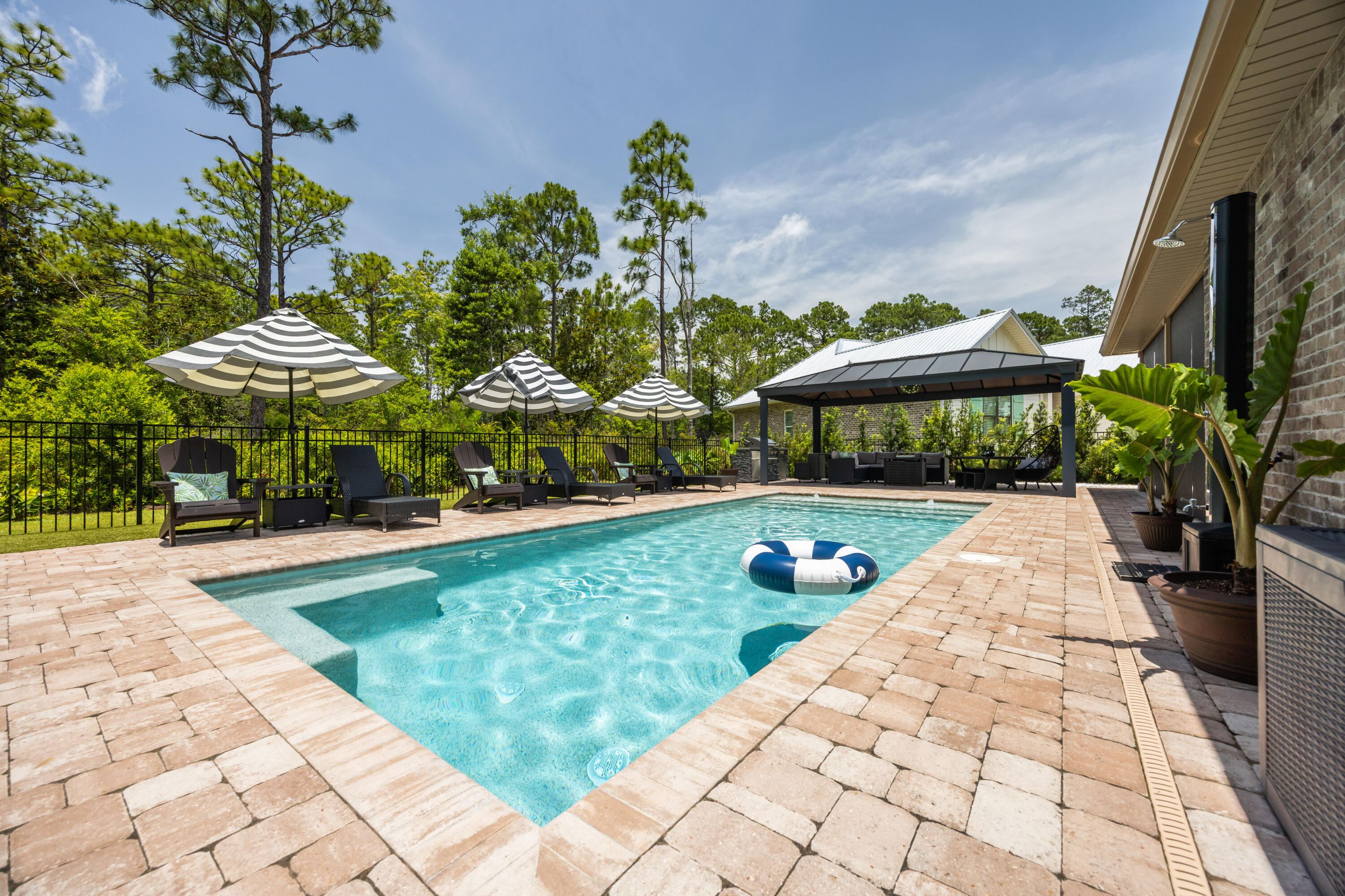Immaculate Custom Home with Private Pool in Bay Harbour. Welcome to your dream home in the charming waterfront community of Bay Harbour in Freeport! This beautiful 4-bedroom, 3-bathroom custom-built home offers luxurious living with impeccable style and thoughtful design throughout. Step inside to an open-concept floor plan featuring laminate hardwood flooring, tray ceilings and Plantation shutters. The gourmet kitchen is a chef's delight, boasting granite countertops, stainless steel appliances, and plenty of workspace for cooking and entertaining. Retreat to spa-inspired bathrooms with elegant marble countertops and tile flooring. The spacious fourth bedroom upstairs offers flexible use as a bonus room, media space, or guest suite. A large laundry room provides ample storage, and the two-car garage adds convenience and functionality. Enjoy your own outdoor private oasis complete with a resort style pool, fire pit, artificial turf and spacious backyard that backs up to a conservation easement ideal for relaxing or hosting unforgettable gatherings. Located in the desirable Bay Harbour neighborhood, you'll have access to amazing community amenities, including a community dock, tennis court, walking trails and RV/boat storage. Don't miss out, CALL TODAY!