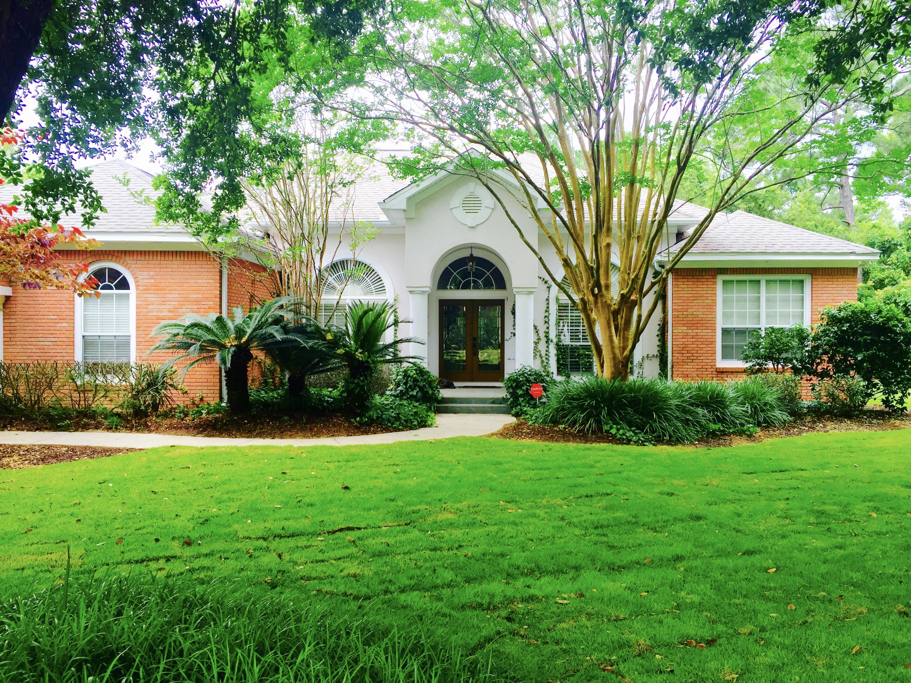 No Flood Insurance Required; Seller has LOMA LETTER. Newly sodded yard with beautiful, mature, landscaping. This home provides the serenity and the amenities you would expect in one of Destin's finest communities. This open air design home has it all! Five bedrooms, a large office, formal living and dining room, eat-in kitchen with island and family room. The spacious living room has a gas fireplace complete with a wall of built-ins. Brazilian Cherry Wood flooring adds to the richness of this home. This home sits on a large lot adorned by beautiful, mature oak trees. The home is 2 homes down from a nature trail/dock to the bay! Amazing sunset views