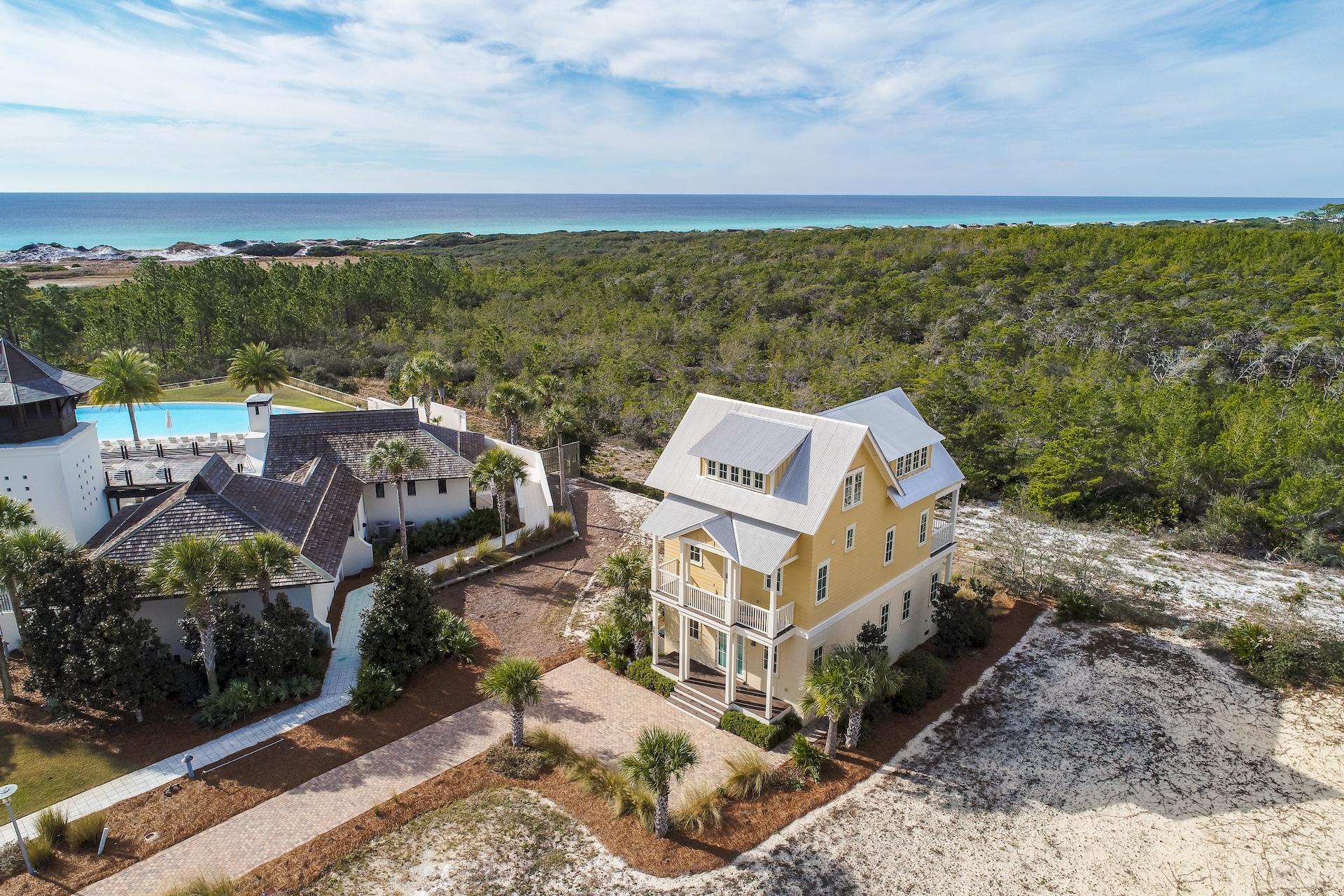 ONE OWNER, NEVER BEEN RENTED with GULF OF MEXICO VIEWS! This beautiful home, built by John Willis Homes, is being sold TOTALLY FURNISHED, has rarely been used and is in pristine condition! Many upgrades include premium solid walnut wide plank flooring throughout, custom maple bead board cabinets with soft close throughout, wired for surround sound on the main living area, outside porch, and master bedroom, flush mounted premium ceiling speakers in master bedroom for TV or stereo, two living areas, foam insulation, natural gas line hook up on the 2nd floor porch for a gas grill, outdoor shower with enclosure, well and pump for irrigation system, Gulf and Topsail Hill State Park views from 2 levels, backs up to the