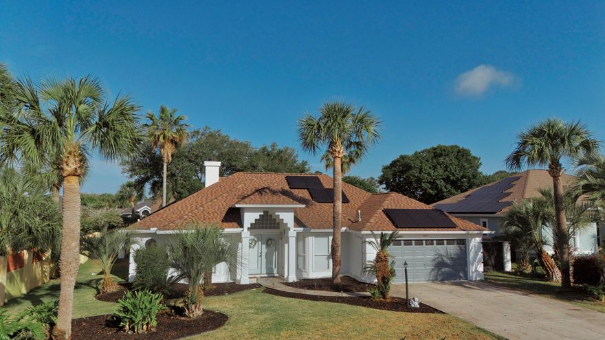 Welcome to 121 Palm Bay Blvd, a beautifully updated 3-bedroom, 3-bathroom home nestled in the desirable Palm Bay community of Panama City Beach. Just minutes from the beautiful beaches!  This 2,200 sq ft residence offers the perfect blend of comfort, style, and functionality. The open-concept floor plan is ideal for both entertaining and everyday living, featuring a cozy gas fireplace and abundant natural light. The kitchen boasts sleek quartz countertops, stainless steel appliances, a gas cooktop, and ample cabinetry. The oversized master bedroom provides a private retreat. Step outside to your own fenced-in backyard with your own private resurfaced gunite pool and outdoor grill center. Enjoy no power bill thanks to the solar panels!  Reach out today to set up your private tour!