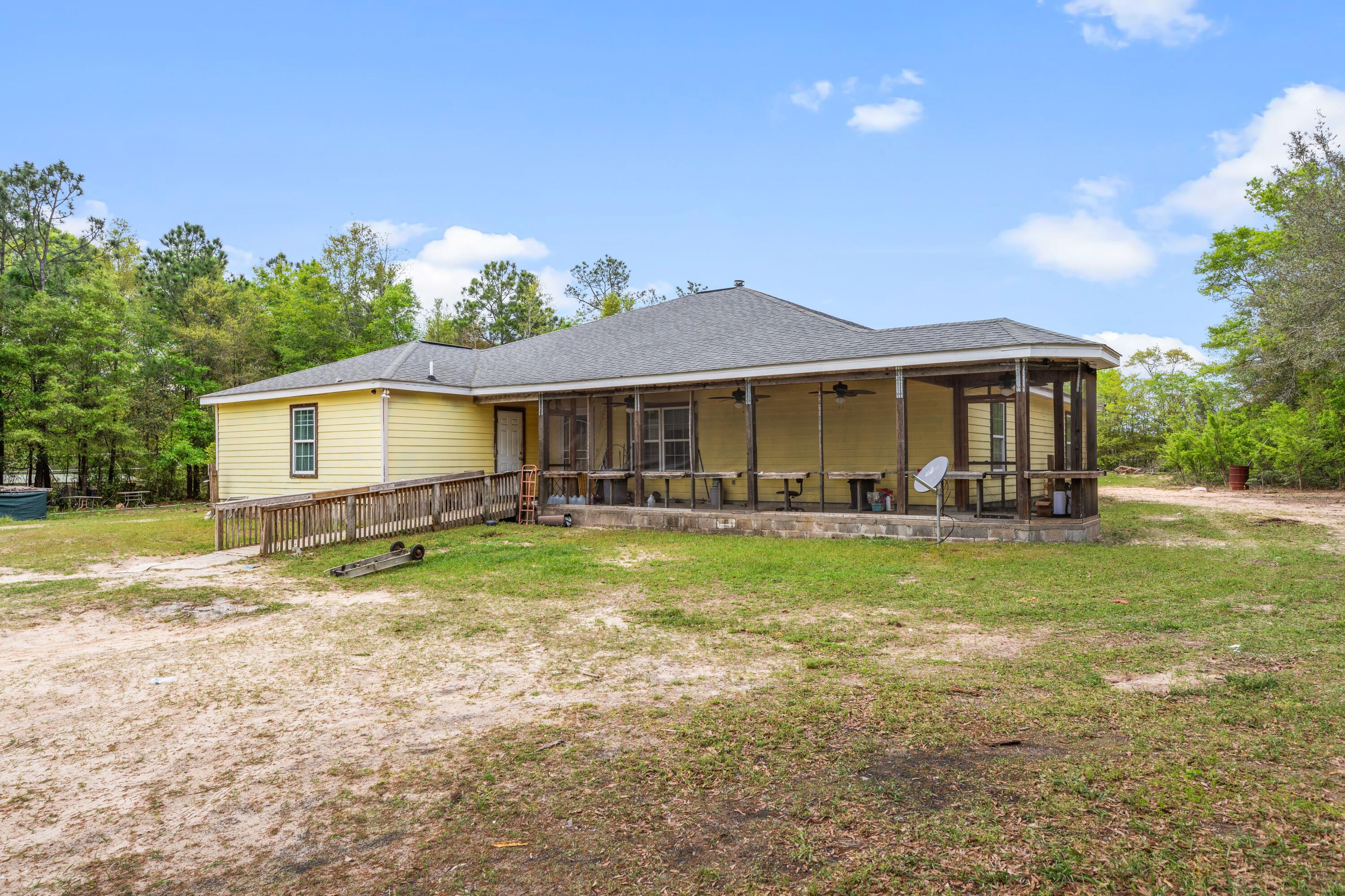 Endless Potential on 3 Beautiful Acres -- Transform This 3,416 Sq Ft Fixer-Upper into Your Dream Home!Welcome to your future dream home! Tucked away on 3 serene, wooded acres, this spacious 3,416 sq ft fixer-upper offers the perfect blend of rustic charm, privacy, and boundless potential. Whether you're a savvy investor, a creative renovator, or someone ready to build your legacy, this property is a rare opportunity to craft a custom retreat exactly the way you've always imagined. Step inside to discover a generous floor plan that provides a solid foundation for your vision. The large master suite offers the space and layout to create a luxurious private escapecomplete with room for a spa-style bathroom and custom walk-in closet.

Warm up by the wood-burning stove on cool evenings, or enjoy meals in a future dream kitchen equipped with a double ovenperfect for entertaining, holiday baking, or big family dinners. The bones are here; bring your style to life!

Love the outdoors? Relax year-round on your screened-in porch, sip coffee under the covered front porch, or unwind under the stars in your peaceful backyard. There's plenty of space for a garden, outdoor kitchen, fire pit, or even a pool. The property also includes an RV hookup, making it ideal for travelers, guests, or extra storage needs.

Additional features include:

A security system already in place for added peace of mind

Ample room to expand, build a shop, or create a homestead

Quiet country living, just a short drive from town amenities

This is not just a homeit's a canvas. With the right vision and updates, this fixer-upper has the potential to become a showstopper. Come see the possibilities and imagine what life could look like in your custom-designed dream retreat.

=?? Schedule a showing today and start planning your transformation!